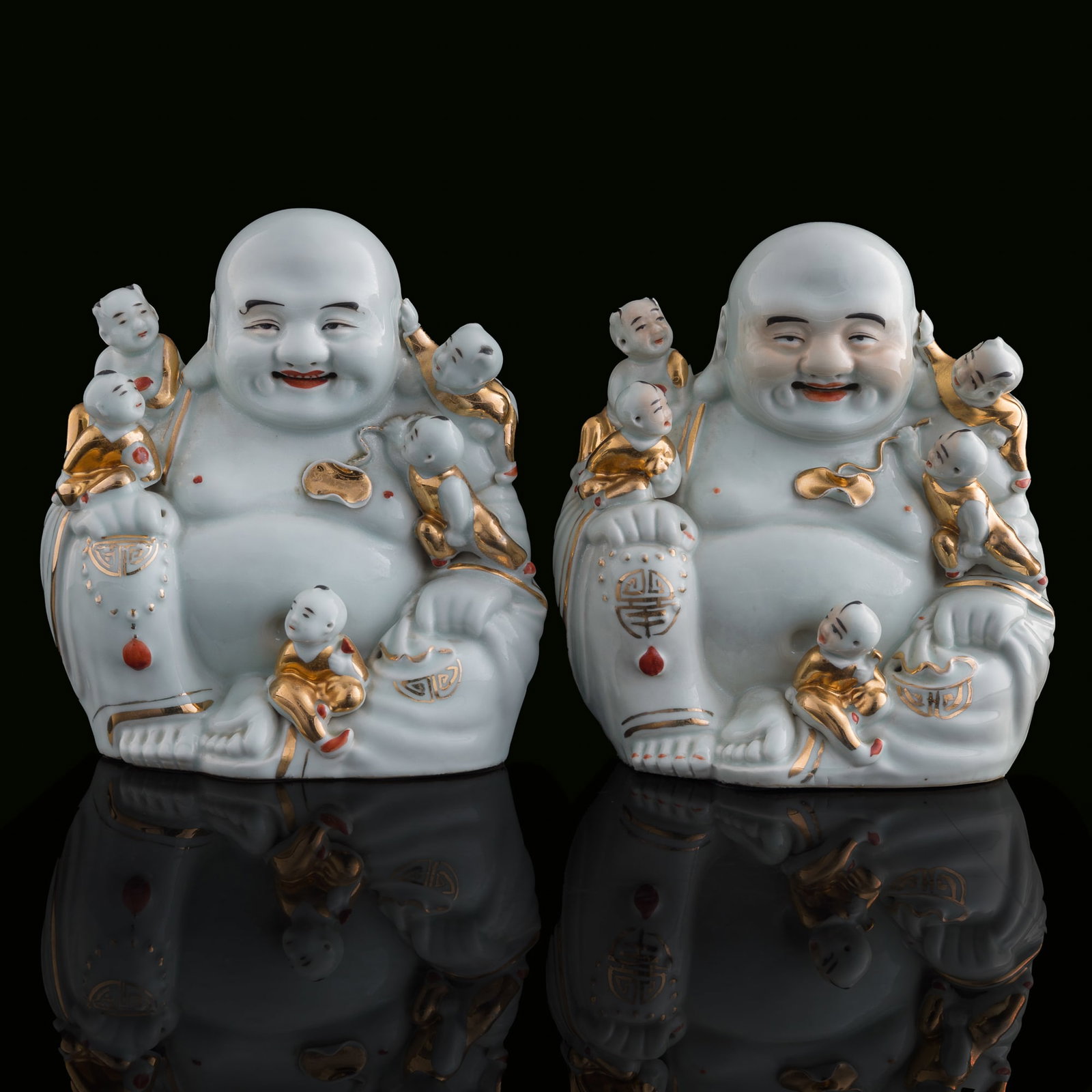 Two Chinese famille rose figures of Buddha, Republic period: Two Chinese famille rose figures of Buddha Republic period One with "Jiangxi Jingzhen Mao Jisheng zao" mark to underside, the other with "Jingzhen Dongsi ling Mao Jisheng zao chang" mark to underside.