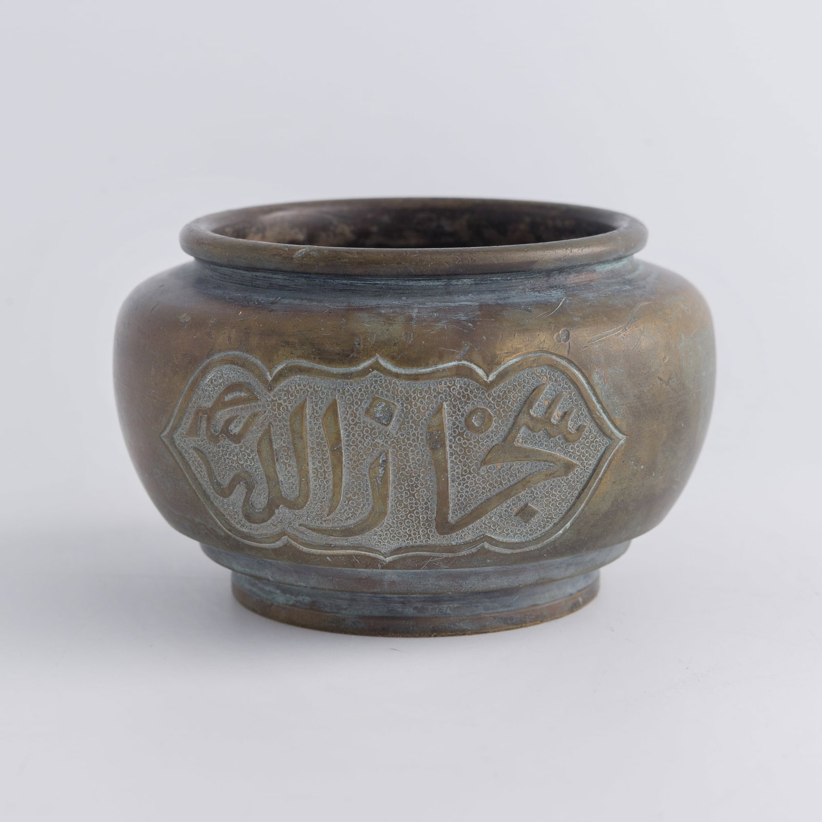 A Chinese bronze 'Arabic inscription' censer, Qing dynasty: A Chinese bronze 'Arabic inscription' censer Qing dynasty H: 2 1/2, Dia: 4 in. (H: 6.4, Dia: 10.2 cm.) Weight: 576.3 g Private collection, New Jersey.