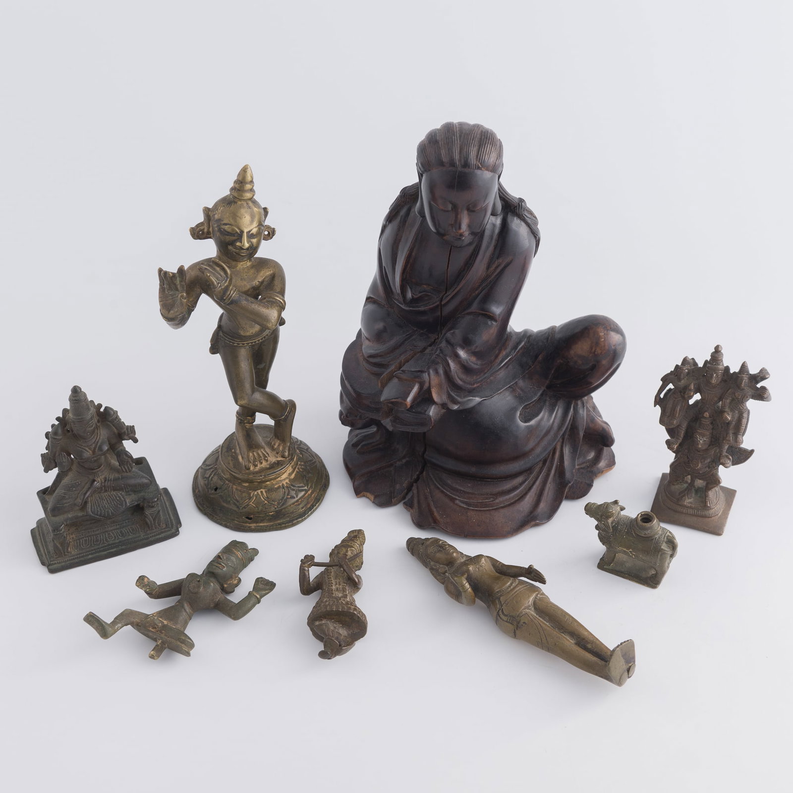 Seven East Asian and Indian wood and metal Buddhist figures, 19th century or earlier: Seven East Asian and Indian wood and metal Buddhist figures 19th century or earlier H: 8, W: 5 1/2, D: 4 in. (H: 20.3, W: 14, D: 10.2 cm. (largest)) Weight: 1653 g (bronze, overall) Private collection