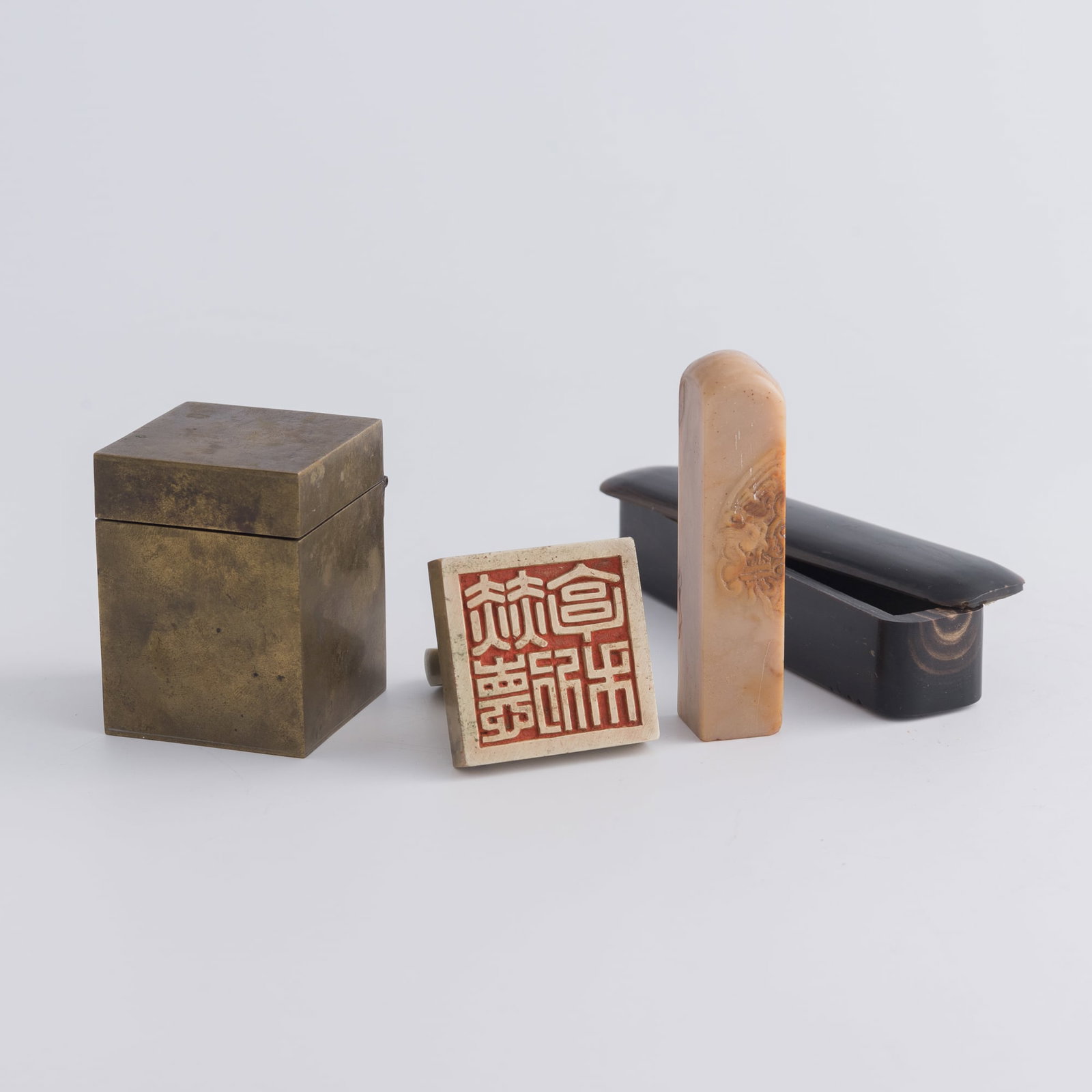 A Chinese copper-alloy seal and a Shoushan stone seal, Qing dynasty/Republic period: A Chinese copper-alloy seal and a Shoushan stone seal Qing dynasty/Republic period H: 3 1/4, W: 3/4, D: 3/4 in. (H: 8.3, W: 1.9, D: 1.9 cm. (Shoushan)) Private collection, Florida.