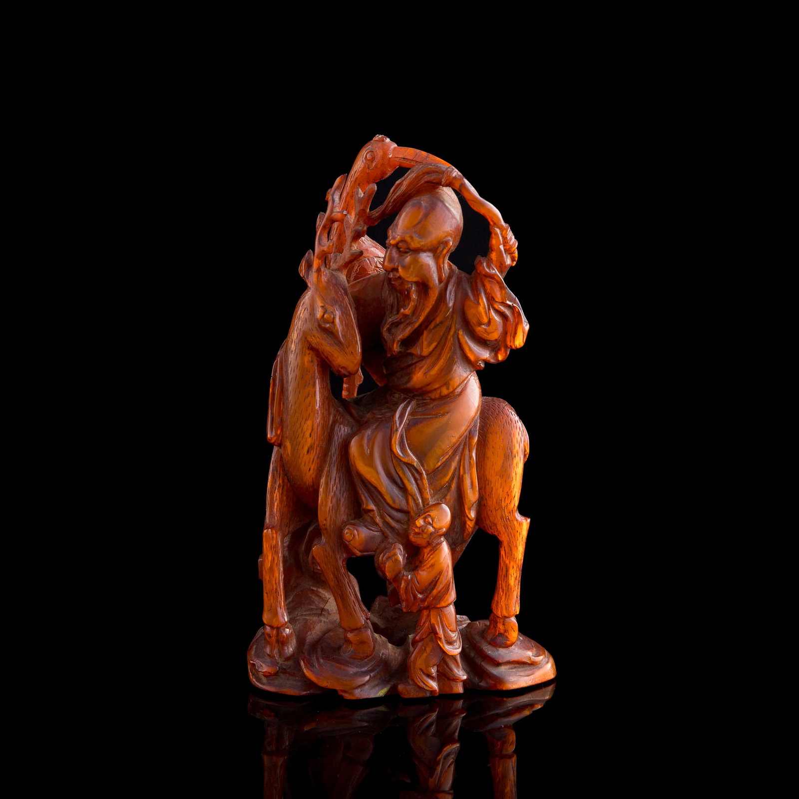 A Chinese carved buffalo horn Shou figure, 19th century: A Chinese carved buffalo horn Shou figure 19th century H: 6, W: 3 3/8, D: 2 1/4 in. (H: 15.2, W: 8.6, D: 5.7 cm.) Private collection, Rowland Heights, California. Private collection, New York.