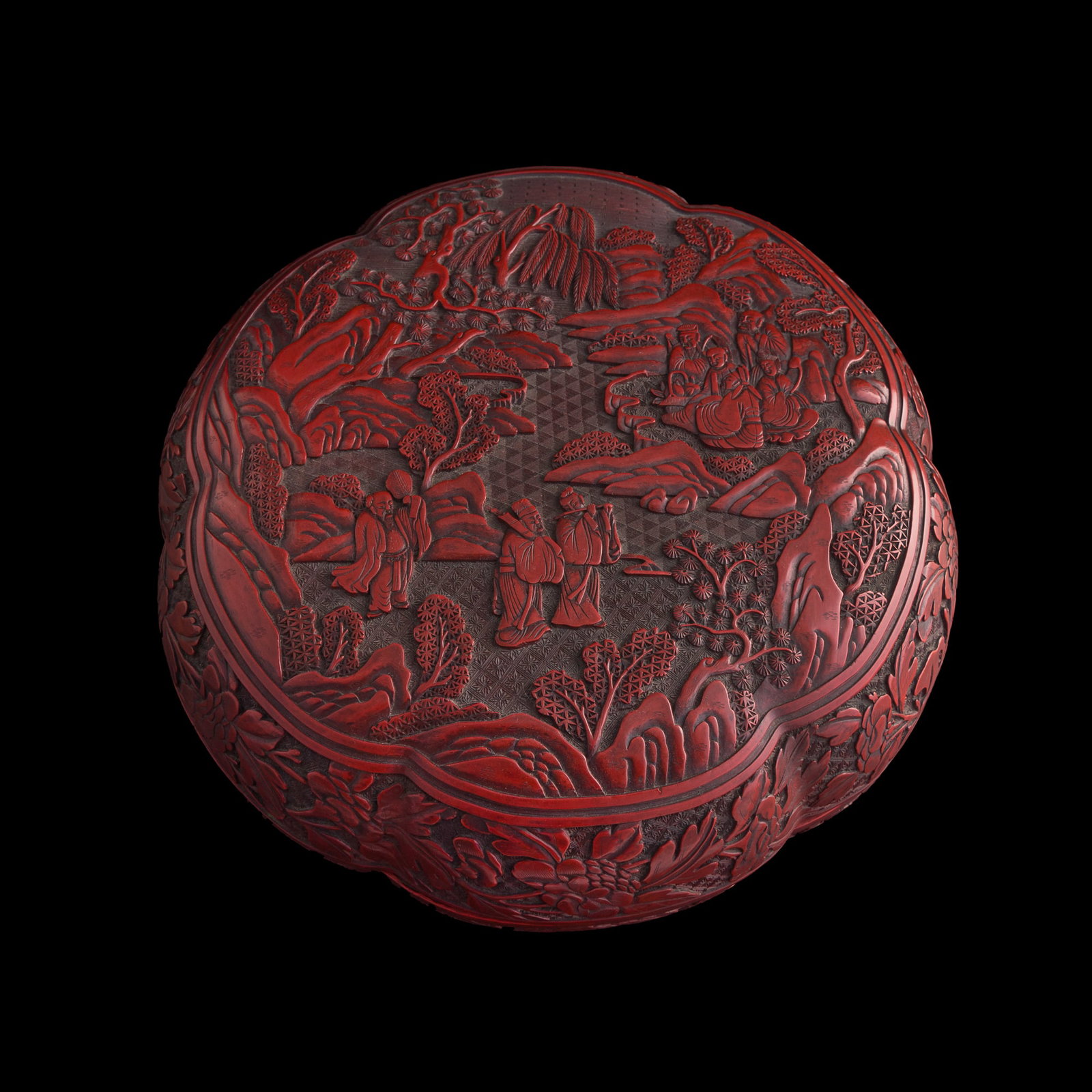 A Chinese cinnabar 'immortals' foliate lidded box, Qing dynasty (1 of 11)
