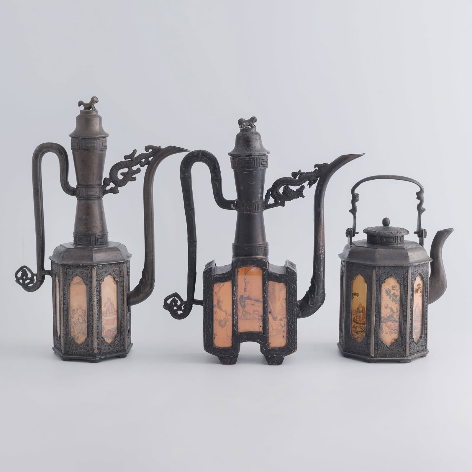 Three Chinese pewter teapots, Qing dynasty/Republic period: Three Chinese pewter teapots Qing dynasty/Republic period Each with nine-character mark to underside. (3). H: 12, W: 8 5/8, D: 4 1/4 in. (H: 30.5, W: 21.9, D: 10.8 cm. (largest)) Weight: 5045 g (overa