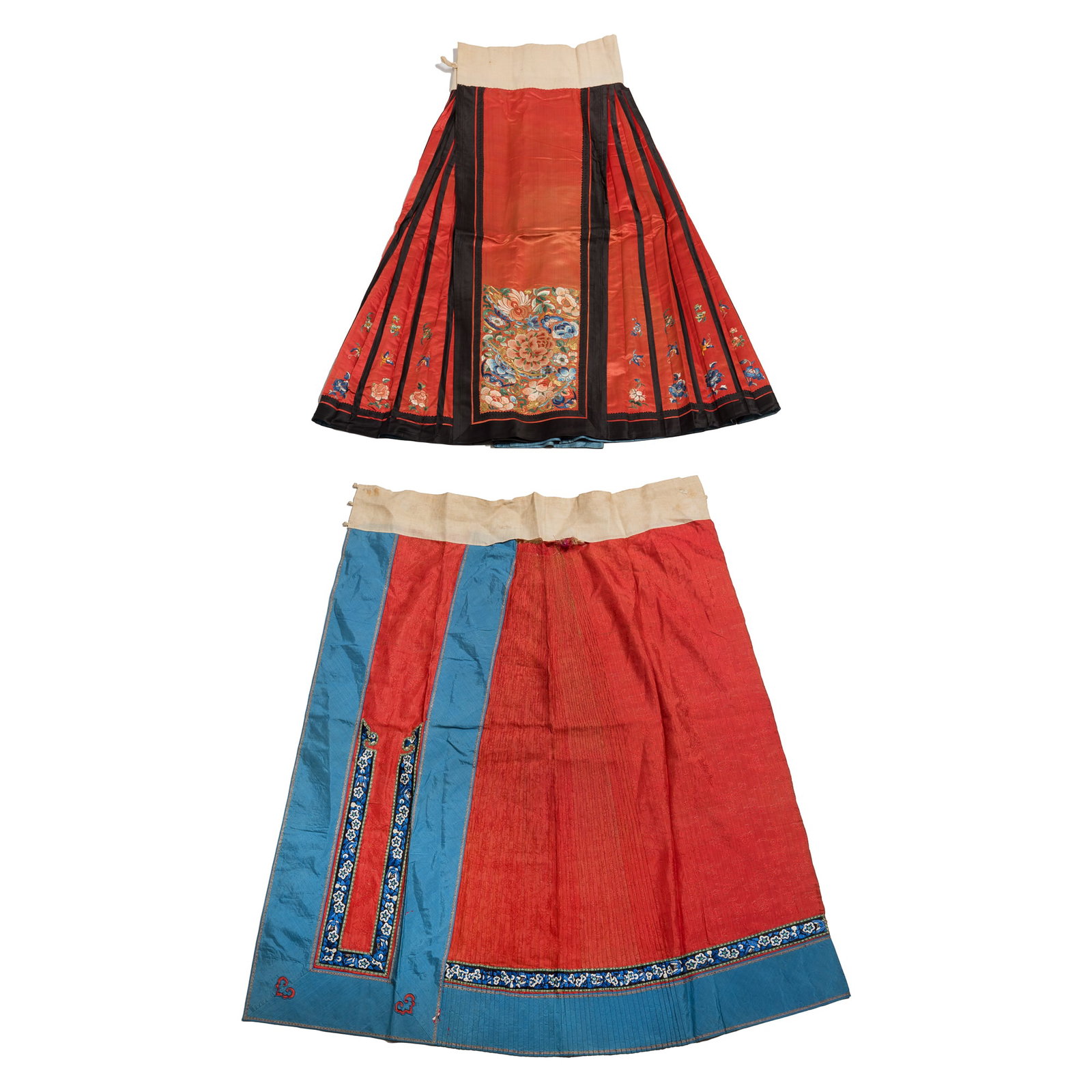 A Chinese red-ground embroidered skirts and a skirt fragment, 19th century: A Chinese red-ground embroidered skirts and a skirt fragment 19th century H: 37 1/2, Waist: 40 1/2 in. (H: 95.3, Waist: 102.9 cm. (largest)) From Mrs. Curren in Ventura, California, acquired by her gr