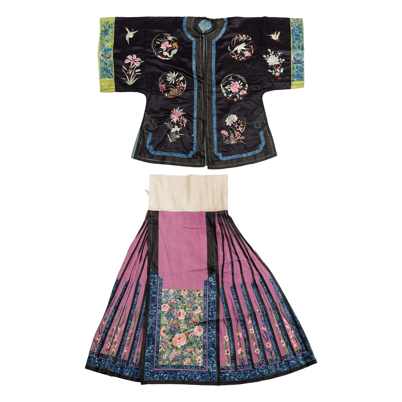 A Chinese black-ground embroidered lady's shirt and a pink-ground skirt, 19th century: A Chinese black-ground embroidered lady's shirt and a pink-ground skirt 19th century H: 34, W: 45 1/2 in. (H: 86.4, W: 115.6 cm. (shirt)) From Mr. Kaufman in Arlington, Virginia; a family heirloom.