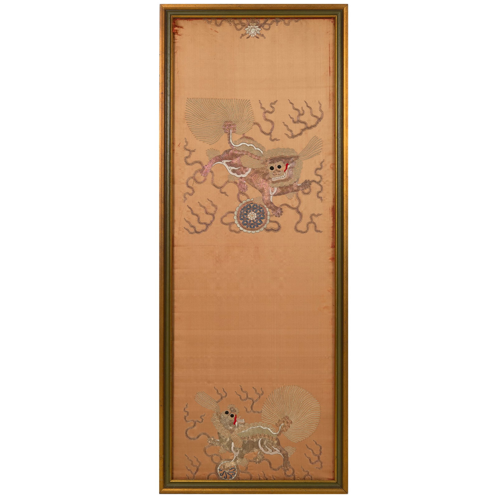 A Chinese apricot-yellow-ground 'lion' embroidery, 19th century: A Chinese apricot-yellow-ground 'lion' embroidery 19th century framed. H: 57, W: 21 3/4 in. (H: 144.8, W: 55.2 cm. (overall)) From Mr. Kaufman in Arlington, Virginia; a family heirloom.