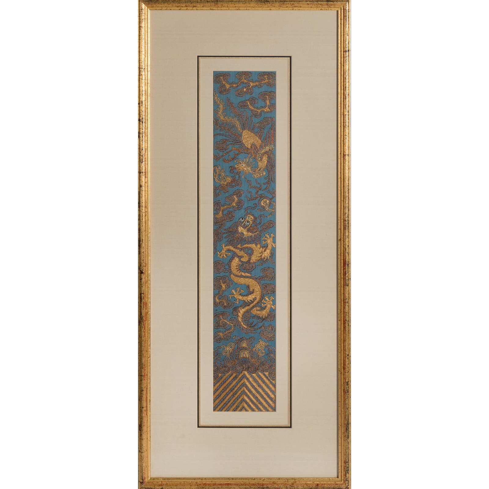 A Chinese blue-ground embroidered 'dragon and phoenix' sleeve band, 19th century: A Chinese blue-ground embroidered 'dragon and phoenix' sleeve band 19th century framed. Sight dimensions: H: 19 1/4, W: 3 3/8 in. (H: 48.9, W: 8.6 cm.) Overall dimensions: H: 27 3/4, W: 11 5/8 in. (H: