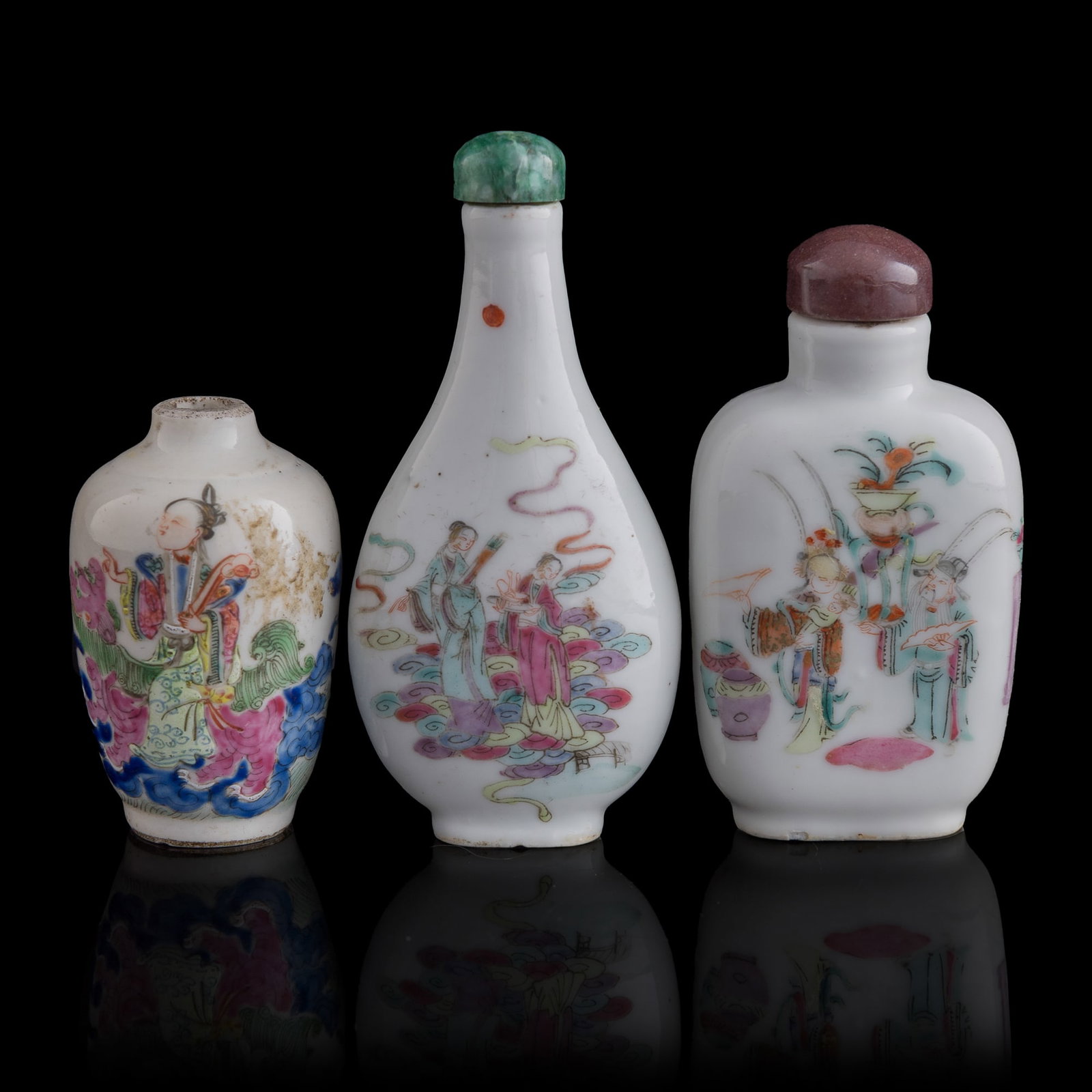 Three Chinese famille rose 'figural' snuff bottles, 19th century: Three Chinese famille rose 'figural' snuff bottles 19th century Two with four-character marks to undersides. (3). H: 3 1/2, W: 1 5/8, D: 3/4 in. (H: 8.9, W: 4.1, D: 1.9 cm. (tallest)) From Mr. Tinero,
