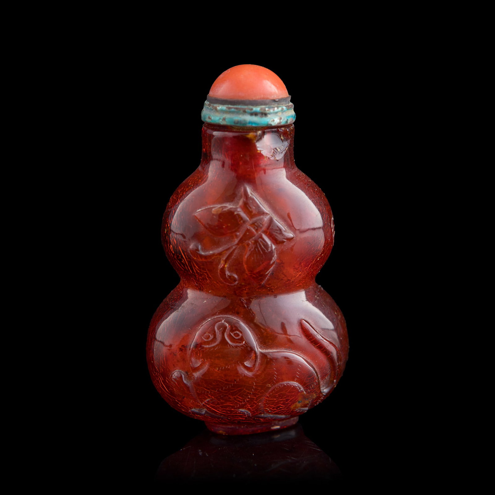 A Chinese amber double gourd-form snuff bottle, 19th century: A Chinese amber double gourd-form snuff bottle 19th century H: 2 3/4, W: 1 1/2, D: 1 in. (H: 7, W: 3.8, D: 2.5 cm.) Weight: 32.26 g (overall) From Mr. Tinero, Calabasas, California; acquired by his fa