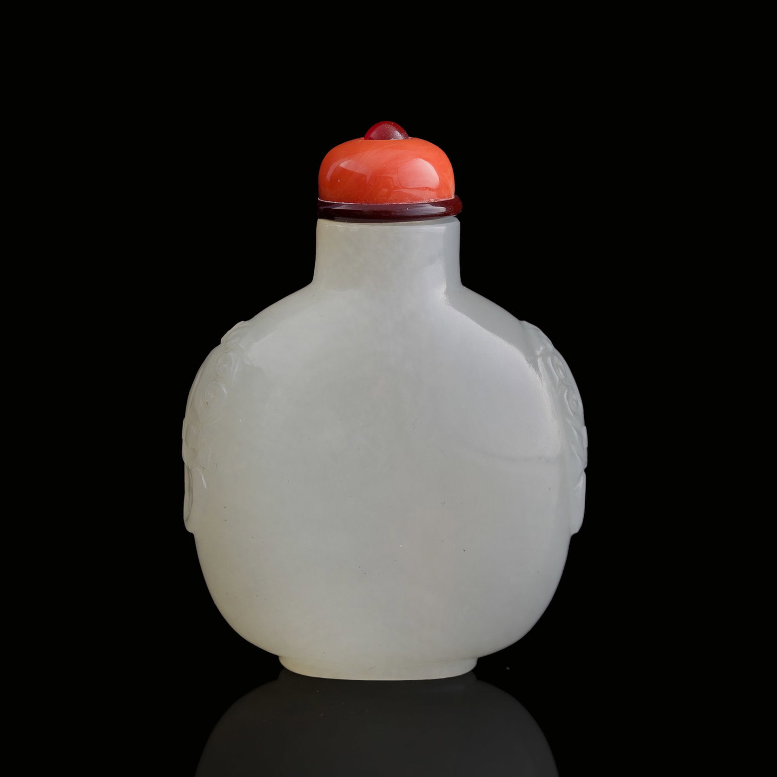 A Chinese white jade mask-handled snuff bottle, 18th century: A Chinese white jade mask-handled snuff bottle 18th century Sold with a fitted box. H: 2 1/2, W: 1 7/8, D: 1 in. (H: 6.4, W: 4.8, D: 2.5 cm.) From Mrs. Kiang in Newport Coast, California; collected by
