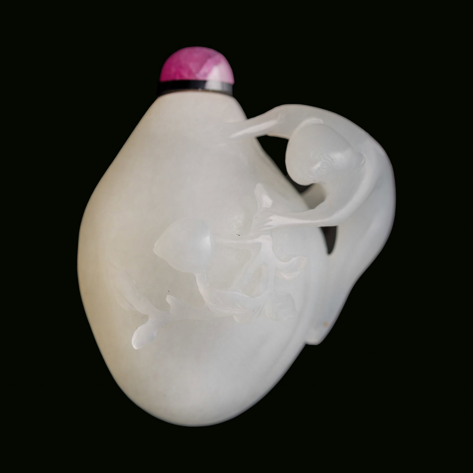 A Chinese carved white jade 'monkey and peach' snuff bottle, 19th century: A Chinese carved white jade 'monkey and peach' snuff bottle 19th century H: 2 1/8, W: 1 5/8, D: 1 1/8 in. (H: 5.4, W: 4.1, D: 2.9 cm.) From Mrs. Kiang in Newport Coast, California; collected by her la