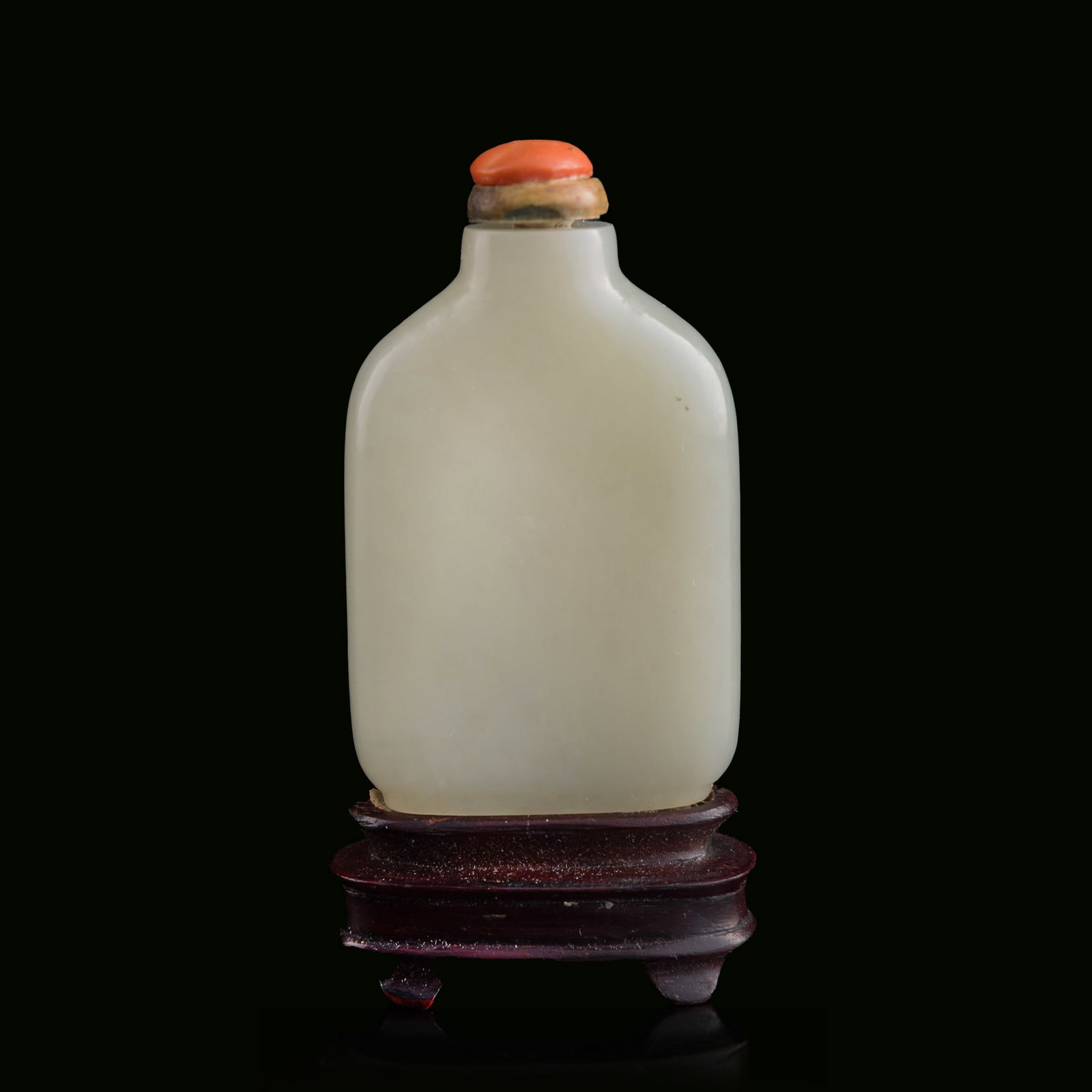 A Chinese white jade snuff bottle, 19th century: A Chinese white jade snuff bottle 19th century Sold with associated wooden stand. H: 2 5/8, W: 1 5/8, D: 5/8 in. (H: 6.7, W: 4.1, D: 1.6 cm. (snuff bottle)) From Mr. Chen, Great Neck, New York; acquir