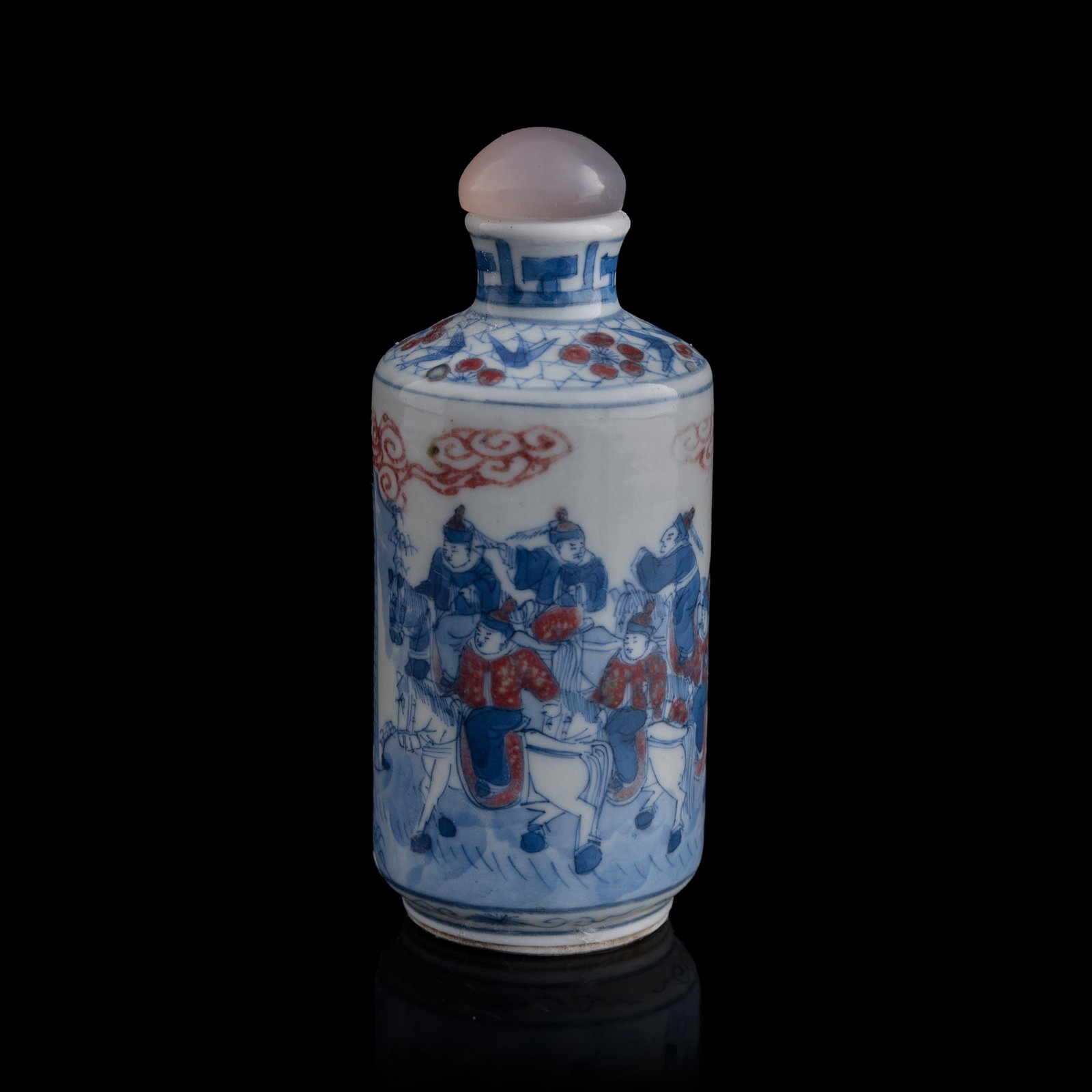 A Chinese blue and copper-red-underglazed 'figural' snuff bottle, 19th century: A Chinese blue and copper-red-underglazed 'figural' snuff bottle 19th century H: 3 7/8, Dia: 1 5/8 in. (H: 9.8, Dia: 4.1 cm.) From Mr. Levin in Van Nuys, California.