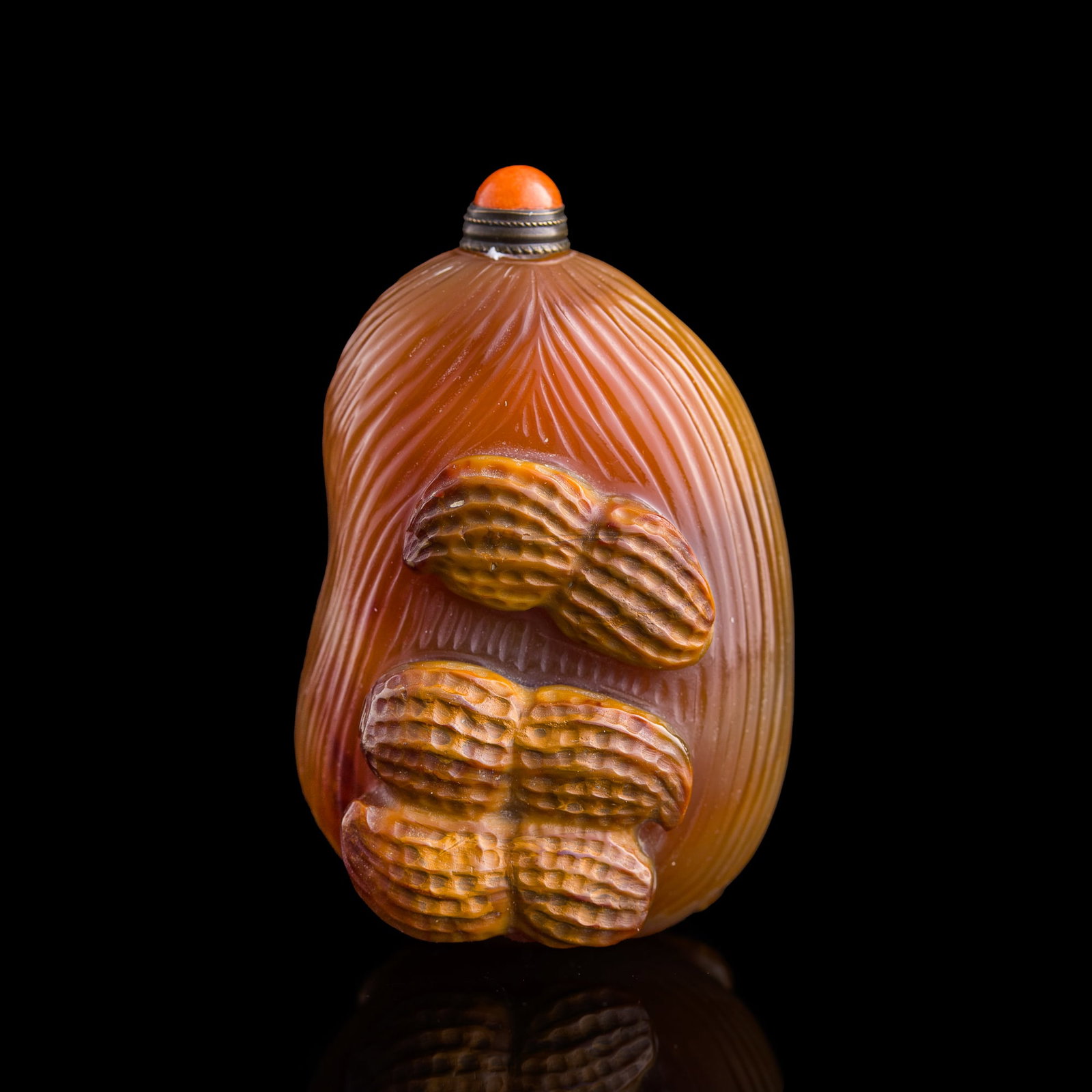 A Chinese carved agate 'peanuts' snuff bottle, 19th century: A Chinese carved agate 'peanuts' snuff bottle 19th century The overall bottle in the form of a jujube, or Chinese date, decorated to one side with three detailed peanuts and with one peanut to the oth