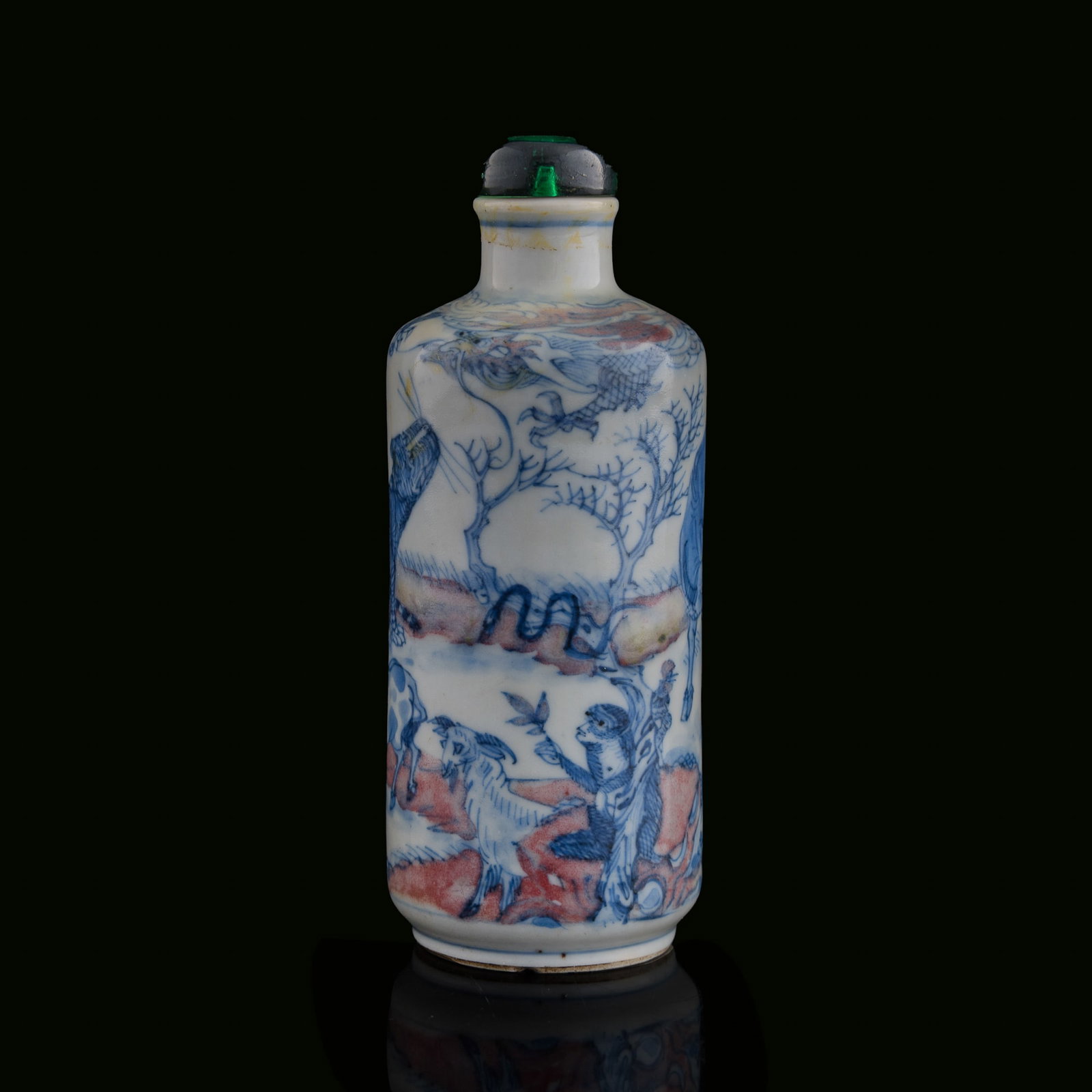 A Chinese blue and copper-red-underglazed 'Twelve Zodiac Animals' snuff bottle, 19th century: A Chinese blue and copper-red-underglazed 'Twelve Zodiac Animals' snuff bottle 19th century H: 5, Dia: 1 7/8 in. (H: 12.7, Dia: 4.8 cm.) From the estate of Mr. Perry, Jacksonville, Florida.