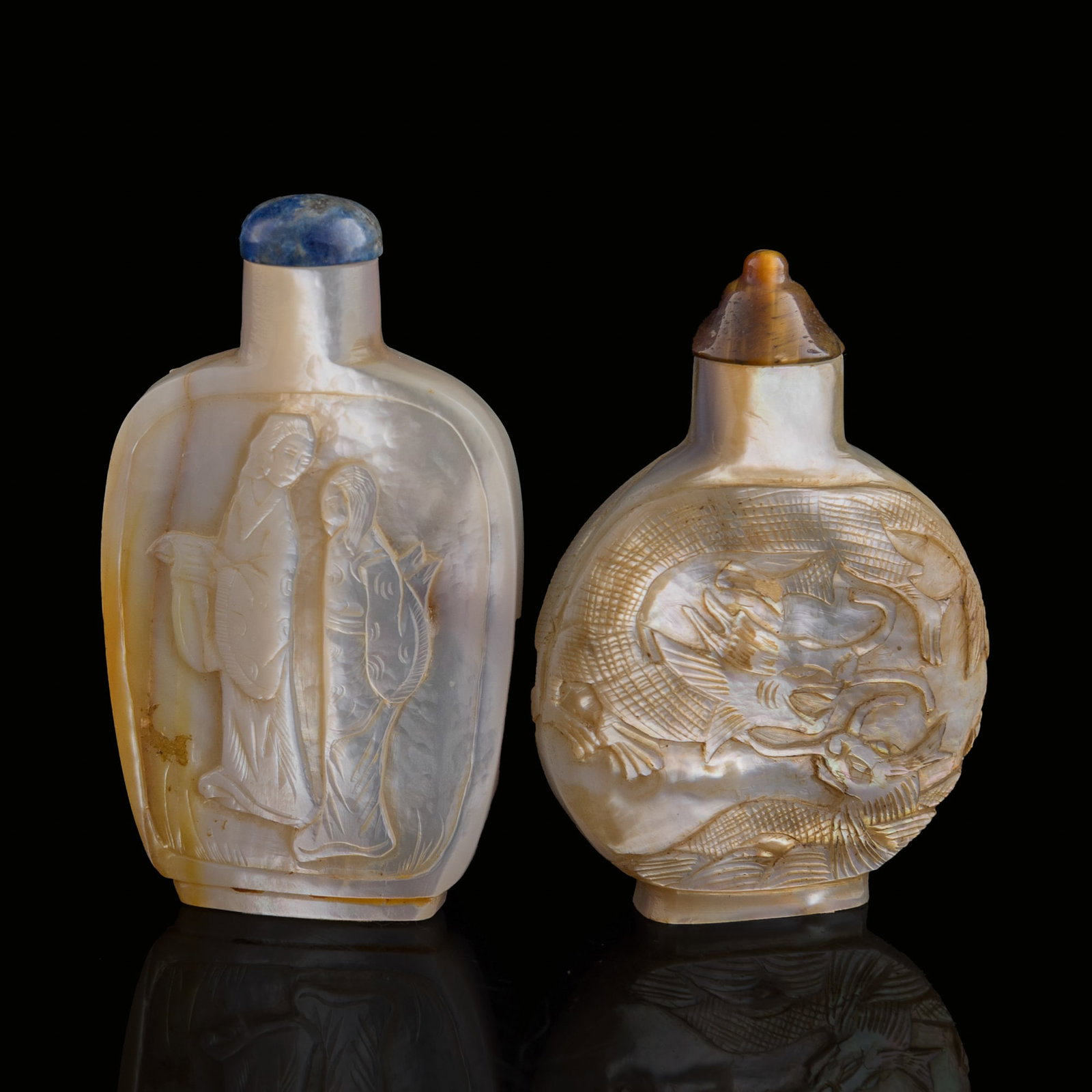 Two Chinese carved mother-of-pearl snuff bottles, Qing dynasty: Two Chinese carved mother-of-pearl snuff bottles Qing dynasty H: 2 7/8, W: 1 5/8, D: 1/2 in. (H: 7.3, W: 4.1, D: 1.3 cm. (largest)) From the estate of Mr. Perry, Jacksonville, Florida.
