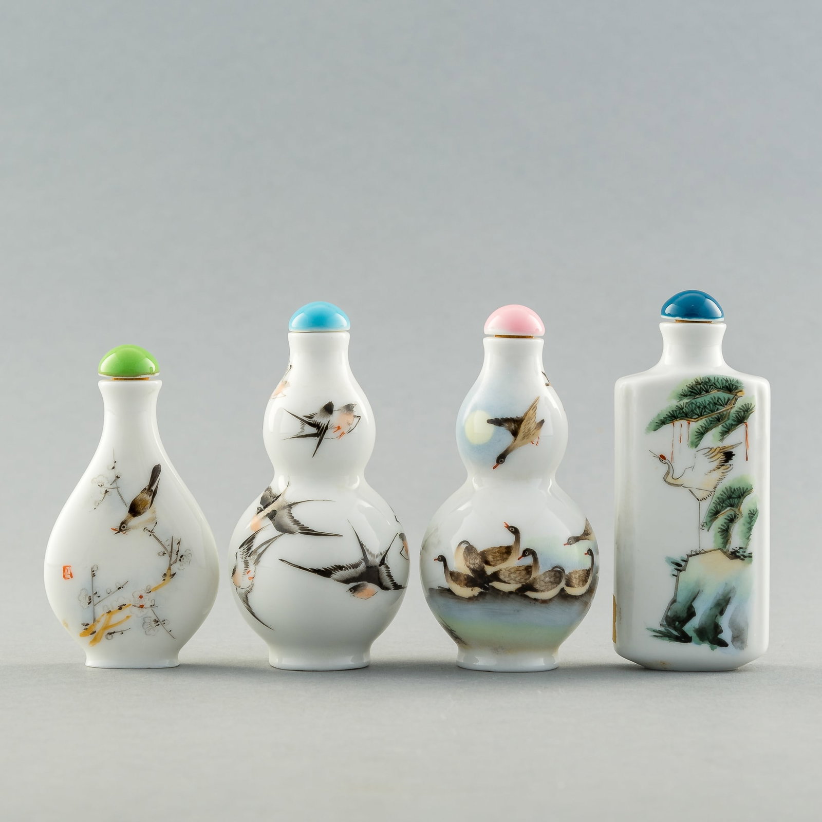Four Chinese famille rose snuff bottles, 1950s-1970s: Four Chinese famille rose snuff bottles 1950s-1970s All featuring scenes of birds; the rectangular bottle with figure on horseback. (4). H: 3 1/8, W: 1 3/8 in. (H: 7.9, W: 3.5 cm. (tallest)) Private c