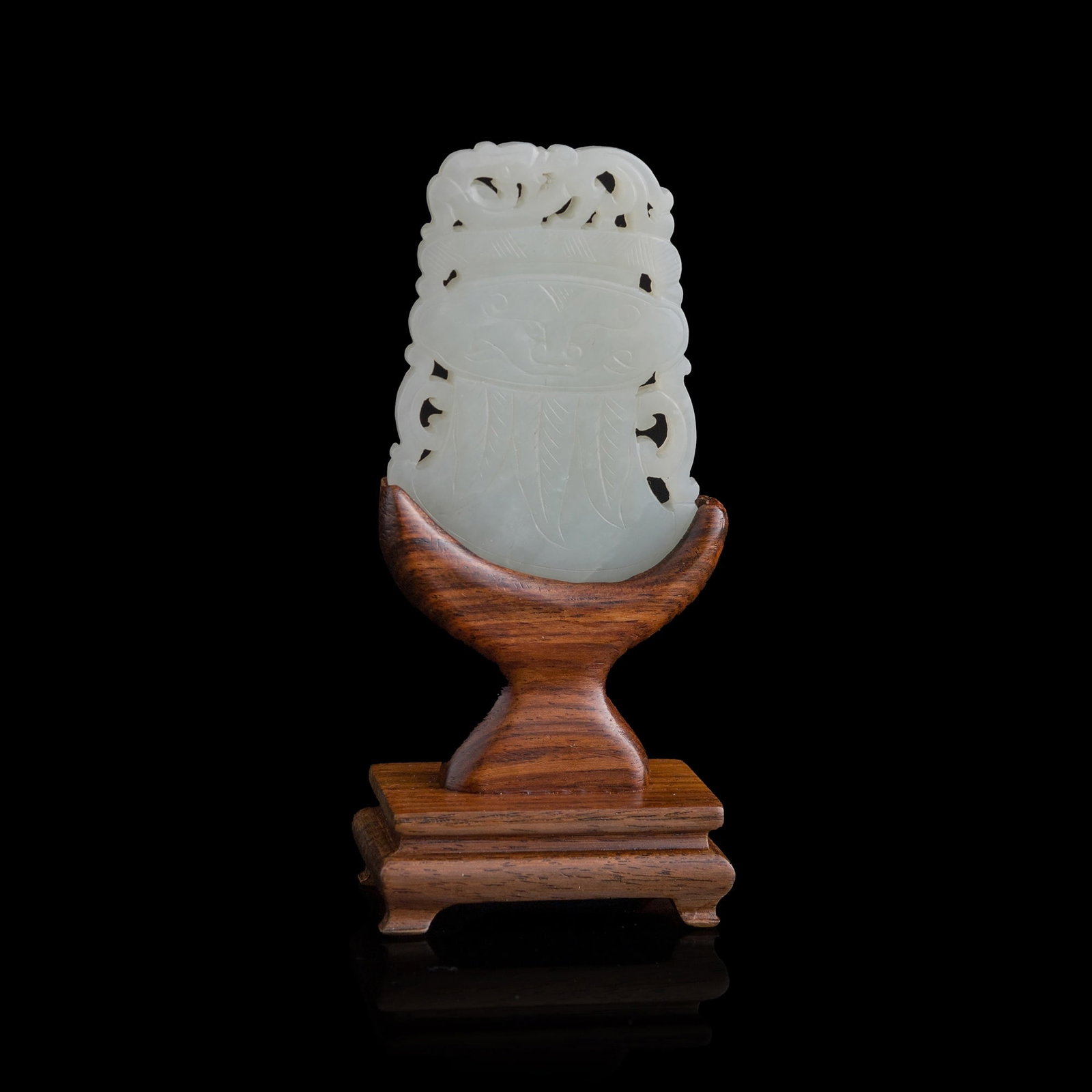A Chinese carved white jade axe-form pendant, 18th century (1 of 10)