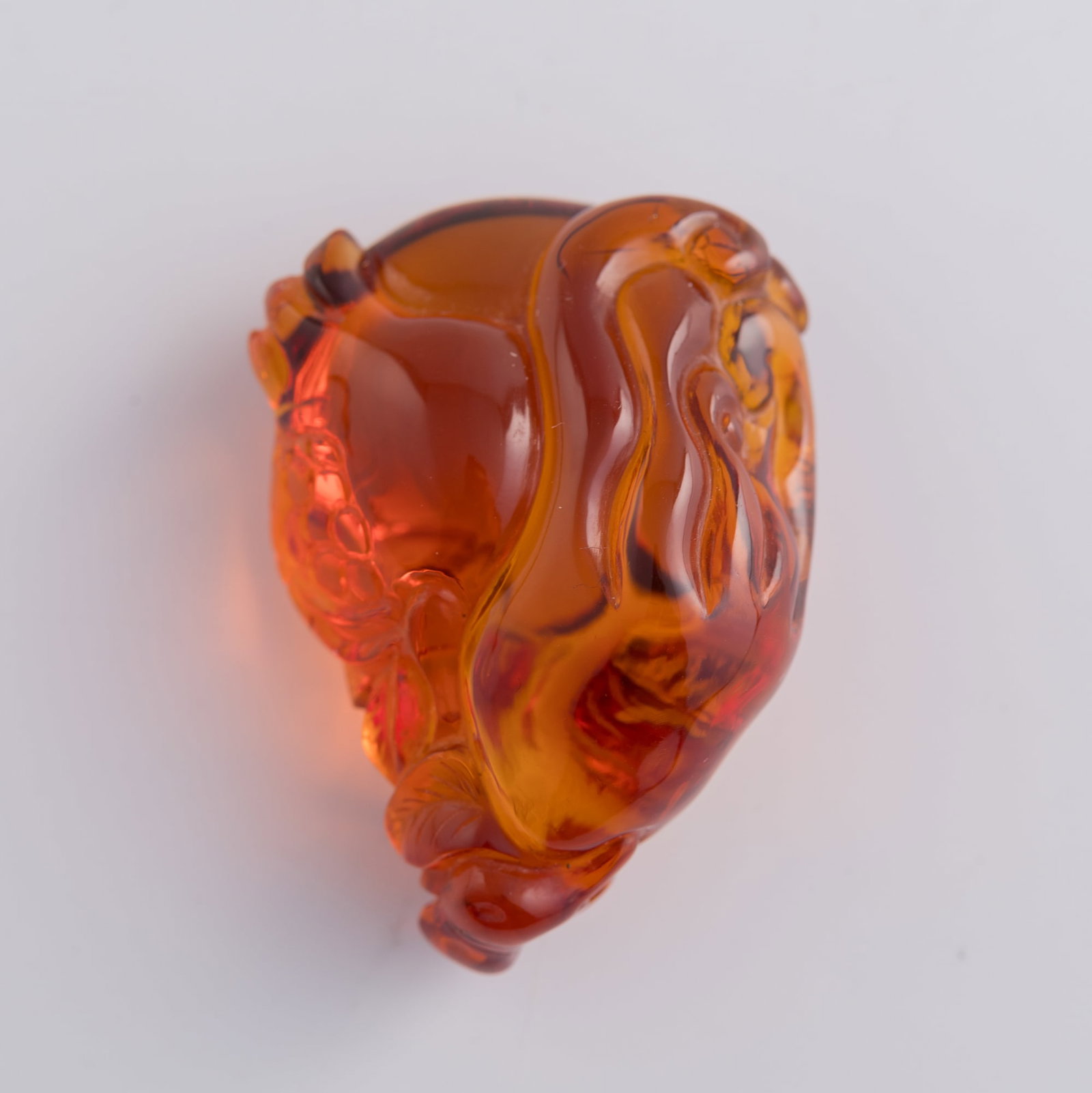 A Chinese amber 'Three Abundances' pendant, 19th century: A Chinese amber 'Three Abundances' pendant 19th century H: 1 3/4, W: 1 1/4, D: 3/4 in. (H: 4.4, W: 3.2, D: 1.9 cm.) Weight: 14.15 g From Mrs. Kiang in Newport Coast, California; collected by her late 