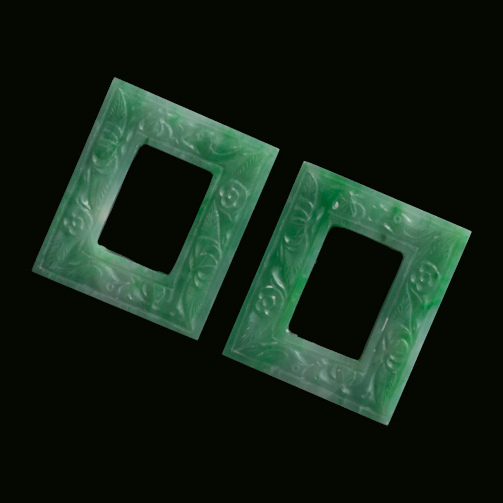 A pair of Chinese jadeite square-form pendants, Qing dynasty: A pair of Chinese jadeite square-form pendants Qing dynasty H: 1 3/16, W: 1, D: 1/8 in. (H: 3, W: 2.5, D: 0.3 cm. (each)) From Mrs. Kiang in Newport Coast, California; collected by her late husband.