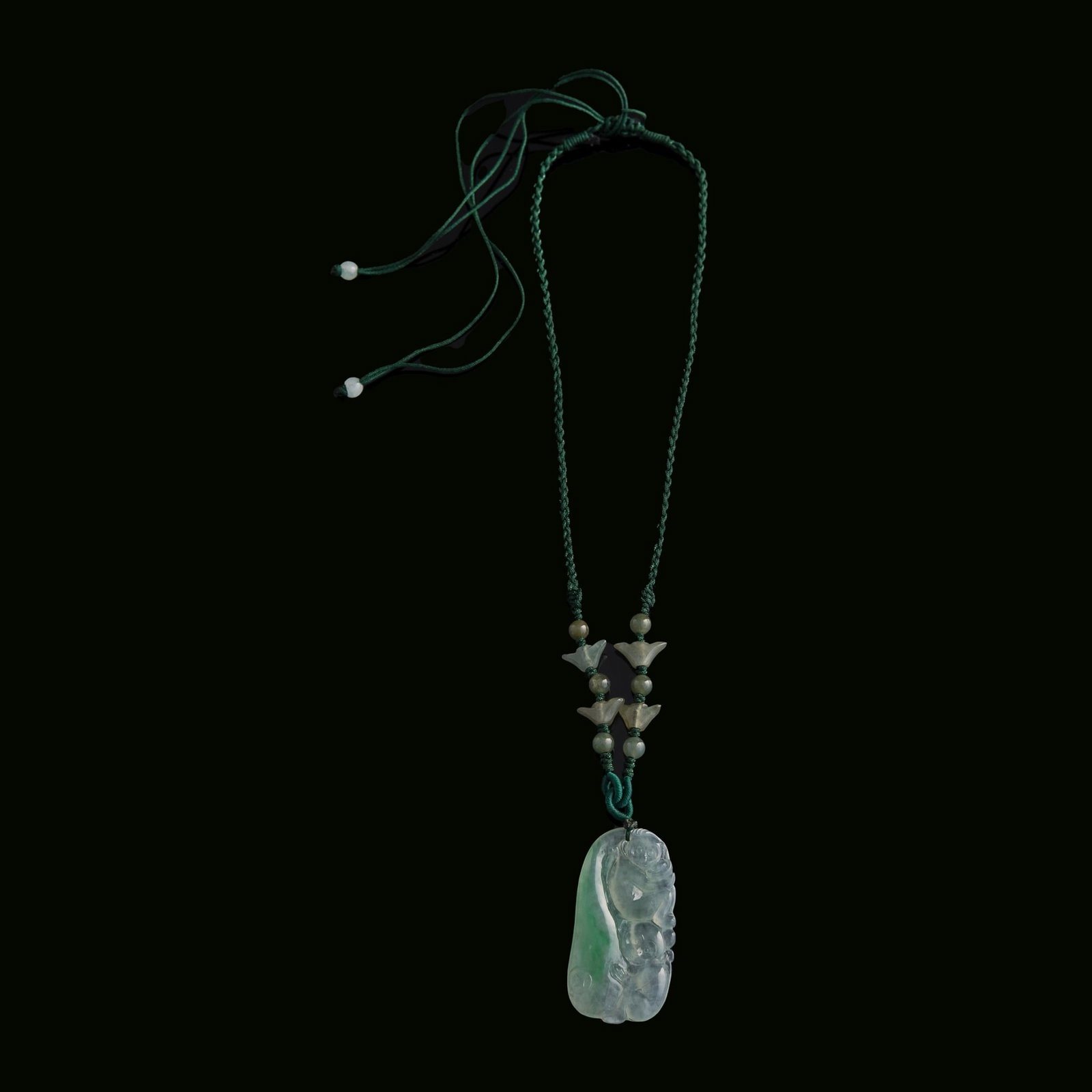 A Chinese jadeite monkey-form pendant: A Chinese jadeite monkey-form pendant H: 1 3/4, W: 7/8, D: 1/8 in. (H: 4.4, W: 2.2, D: 0.3 cm.) From Mrs. Kiang in Newport Coast, California; collected by her late husband. Click here for high