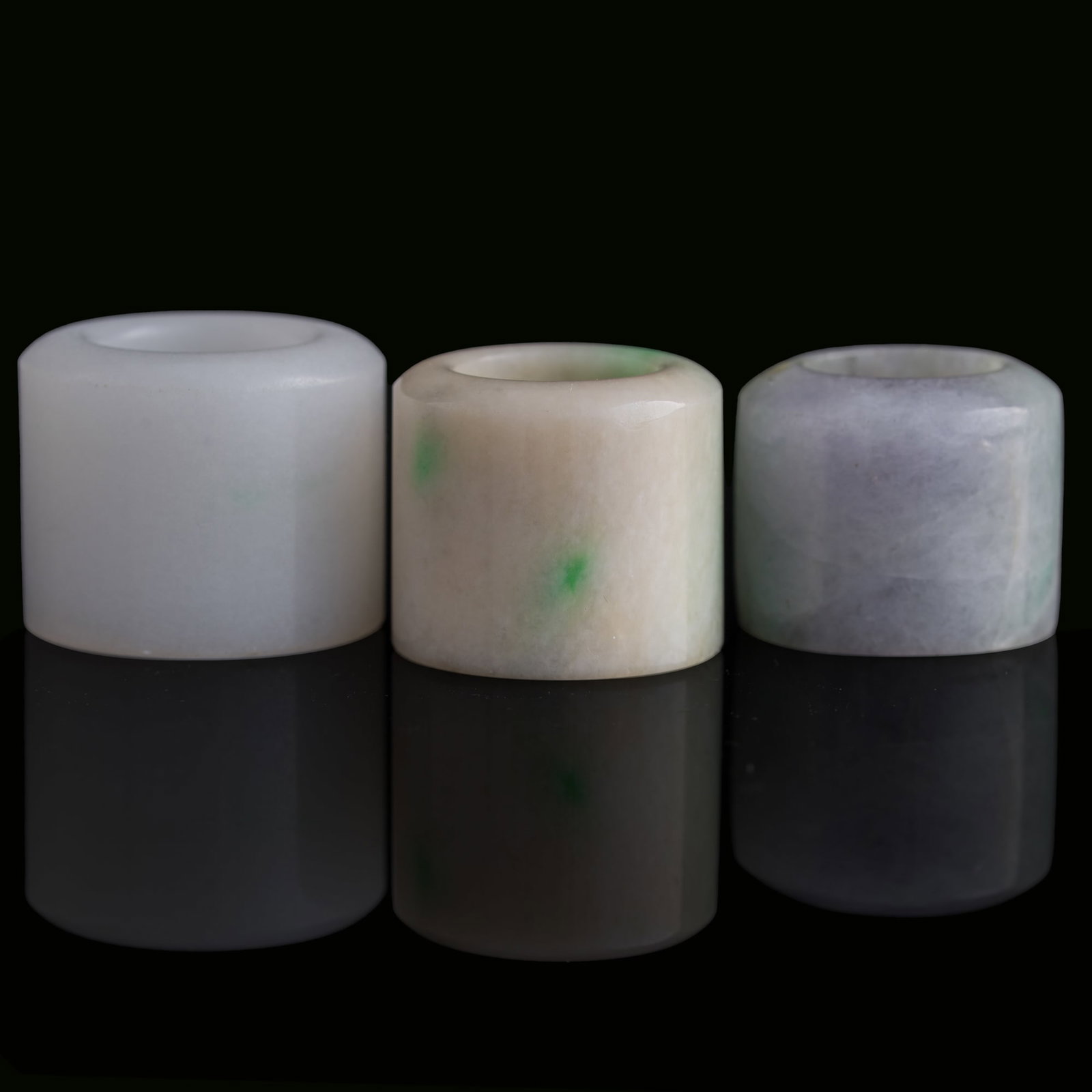 Three Chinese jadeite archer's rings, Qing dynasty: Three Chinese jadeite archer's rings Qing dynasty Inner Dia.: 21.4 mm, H: 30.5 mm (largest) From Mrs. Kiang in Newport Coast, California; collected by her late husband. Click here for high resolution