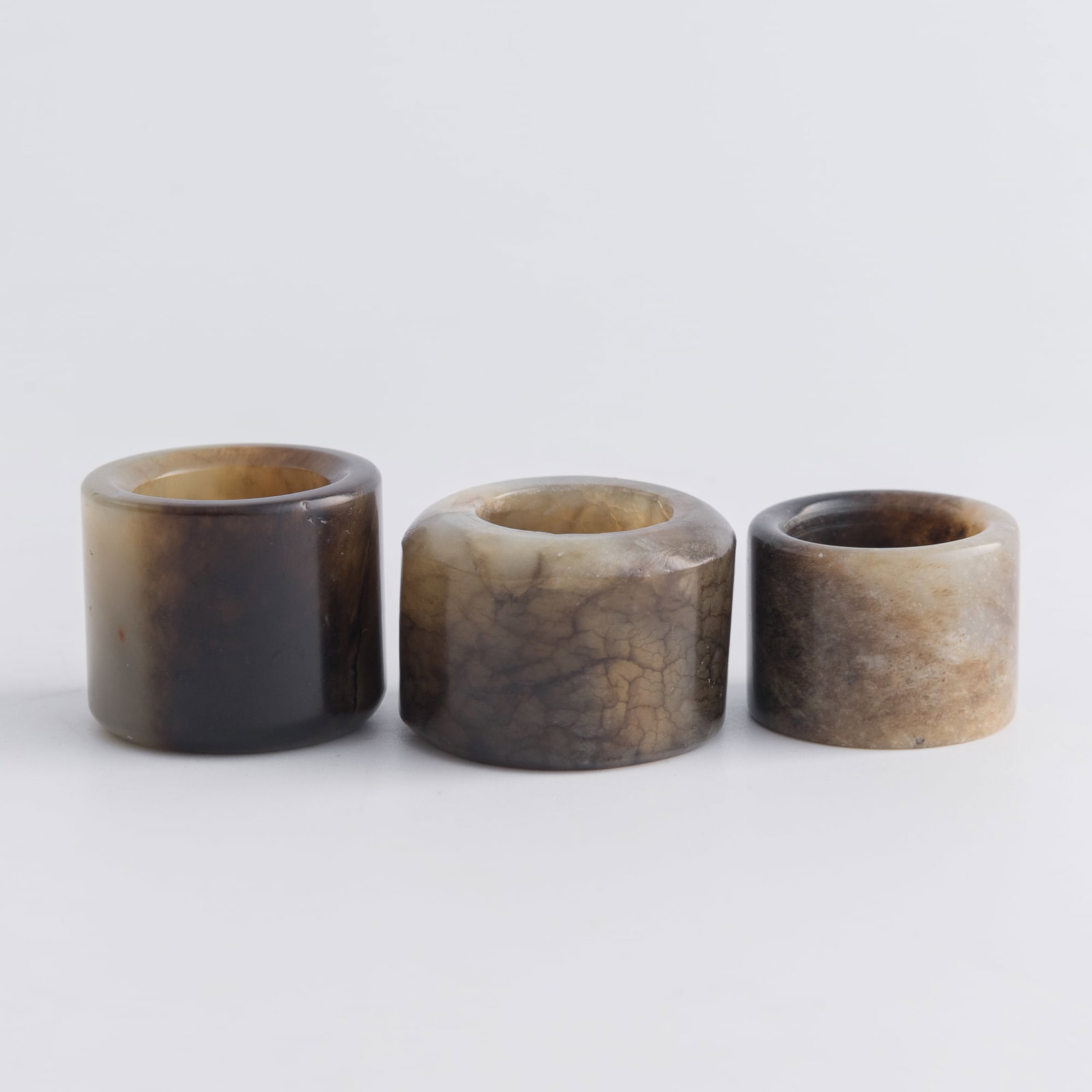 Three Chinese jade archer's rings, Qing dynasty: Three Chinese jade archer's rings Qing dynasty Inner Dia.: 20.8 mm, H: 24.1 mm (largest) From Mrs. Kiang in Newport Coast, California; collected by her late husband. Click here for high resolution