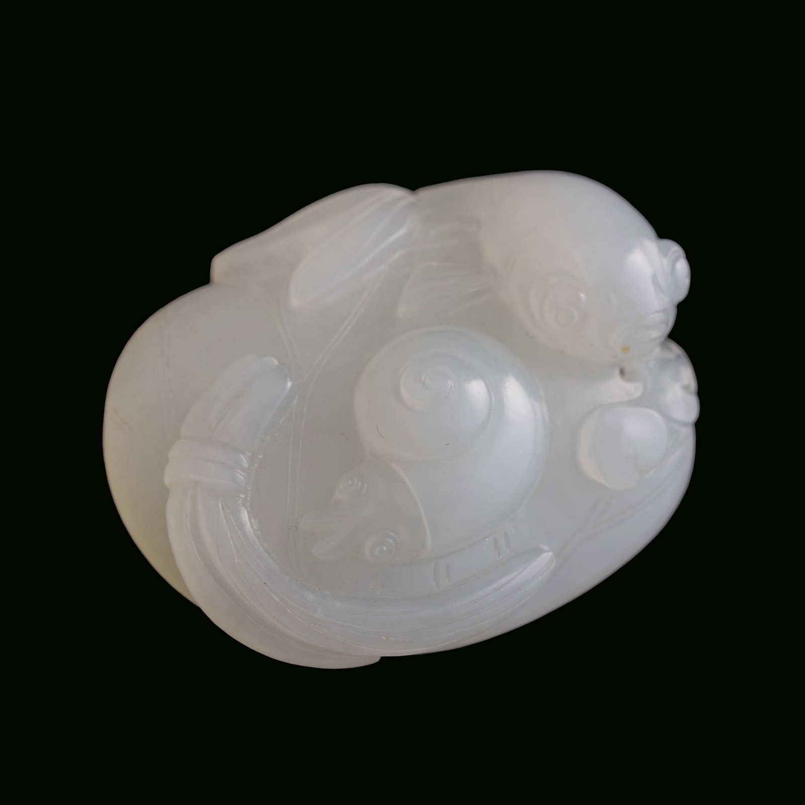 A Chinese carved white jade pendant of lotus pond scene, 19th century (1 of 6)