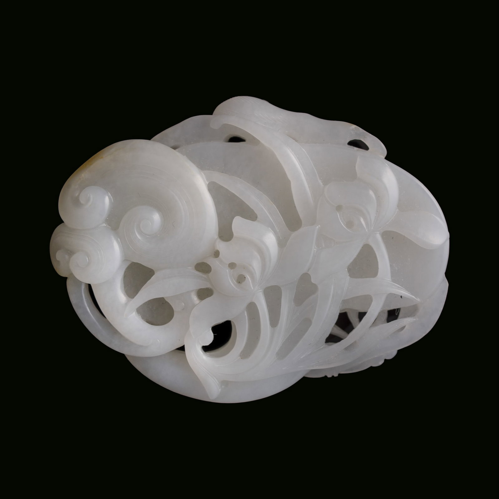 A Chinese carved white jade 'lingzhi and bat' pendant, 18th century: A Chinese carved white jade 'lingzhi and bat' pendant 18th century H: 2, W: 2 1/2, D: 1/4 in. (H: 5.1, W: 6.4, D: 0.6 cm.) From Mrs. Kiang in Newport Coast, California; collected by her late husband.