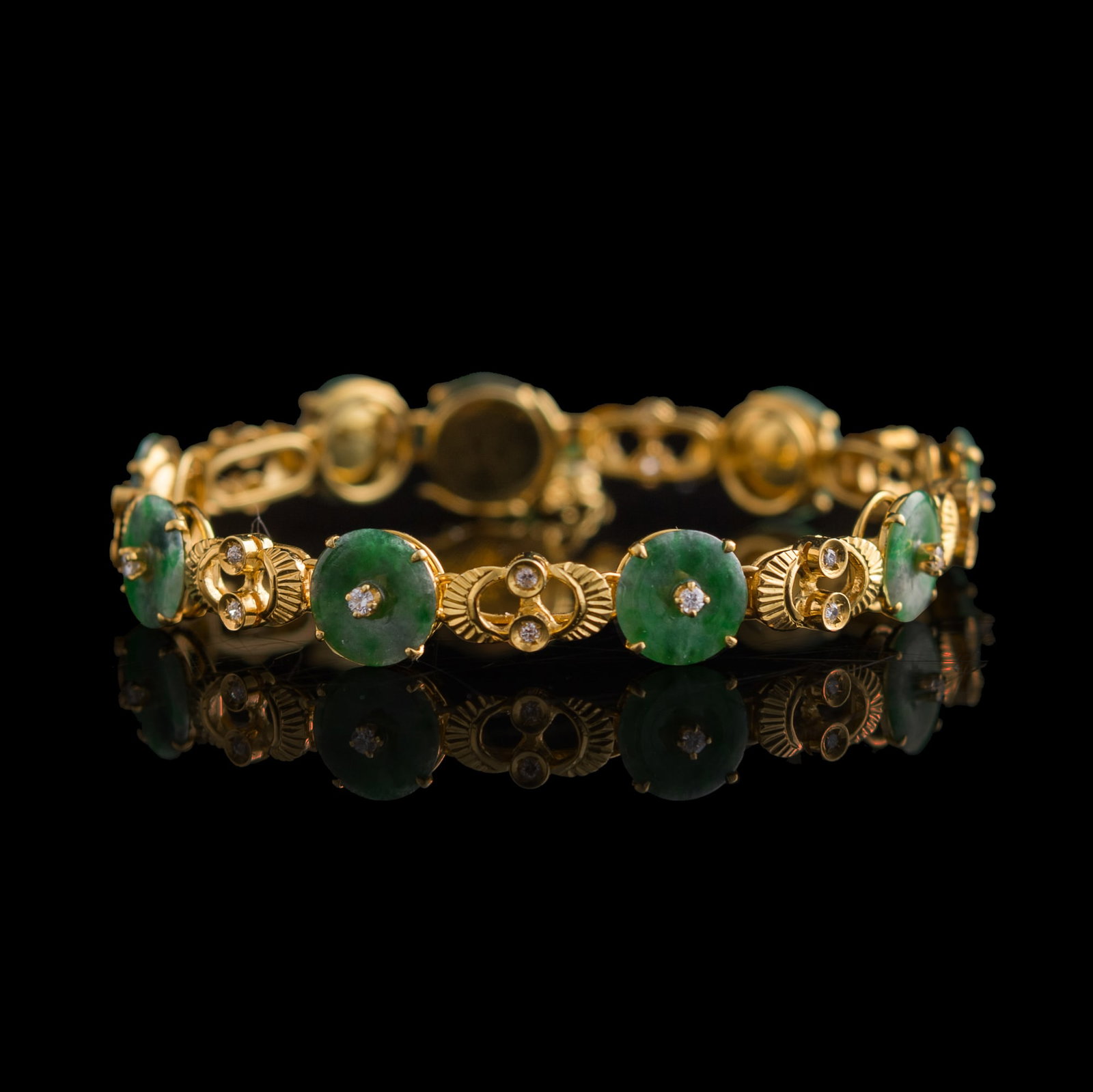 A Chinese metal and jadeite bi-disc bracelet (1 of 6)