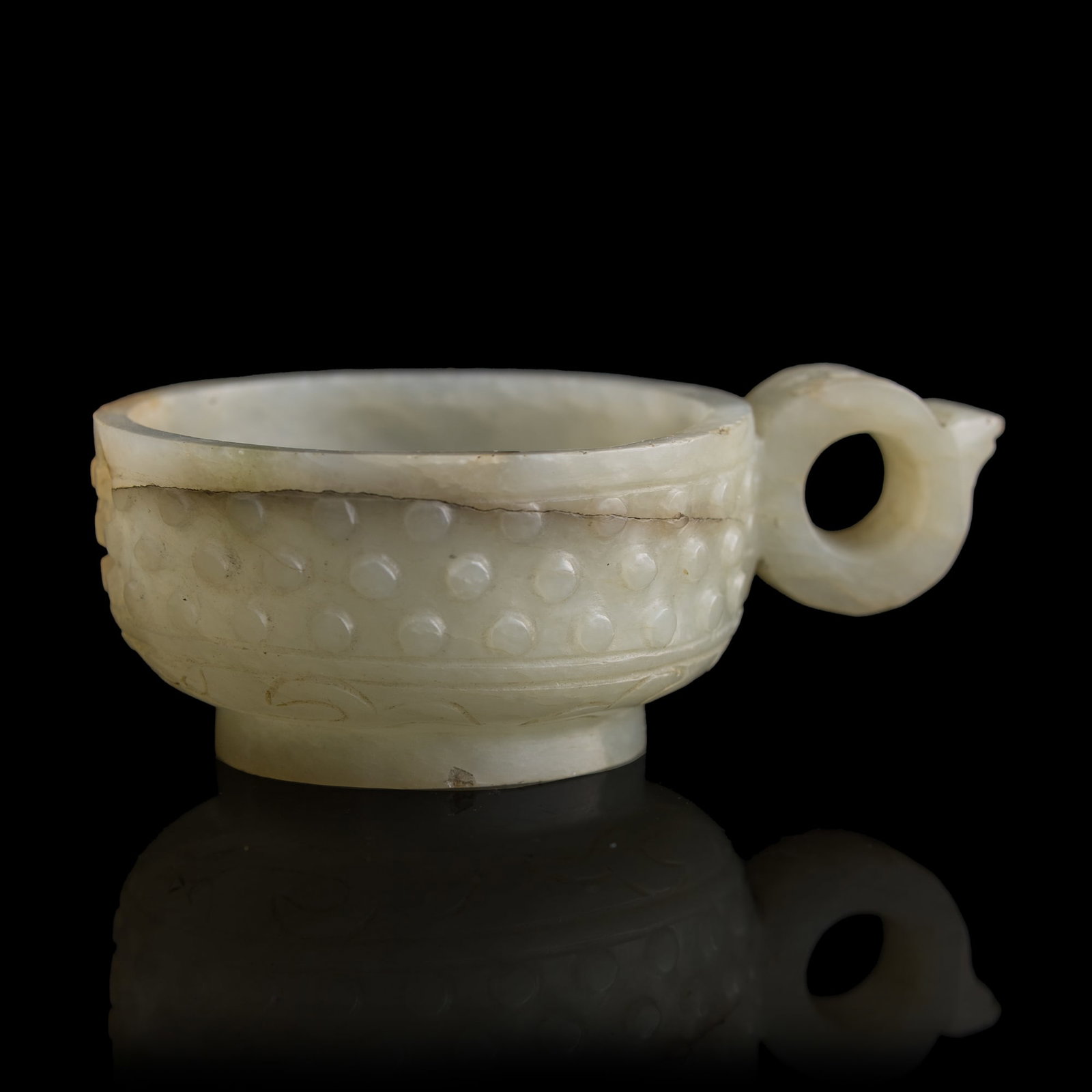 A Chinese white jade handled cup with raised bosses, Ming dynasty (1 of 7)