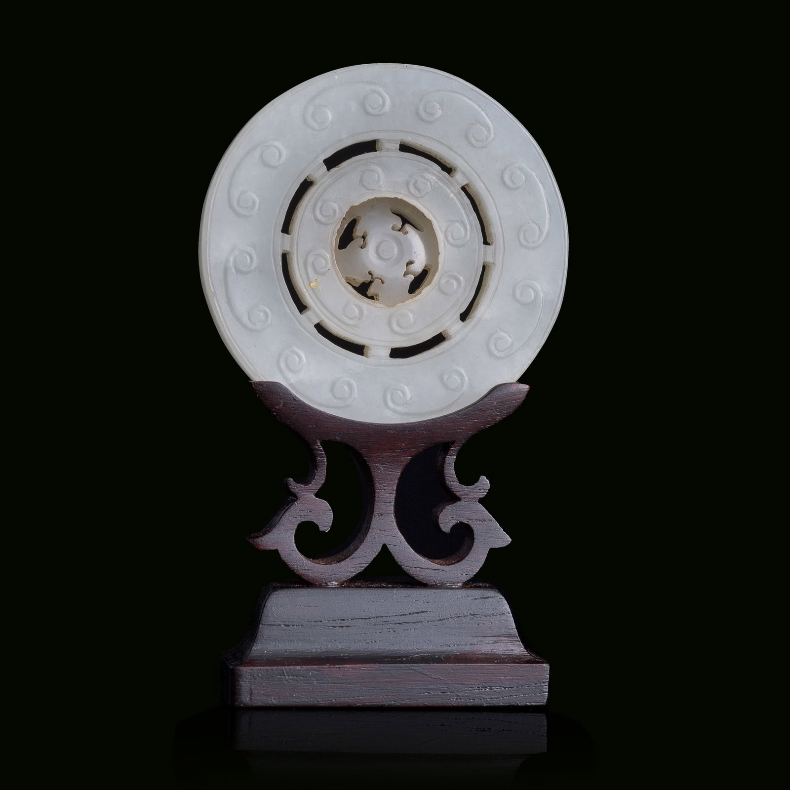 A Chinese carved white jade revolving-center pendant, 18th century (1 of 8)