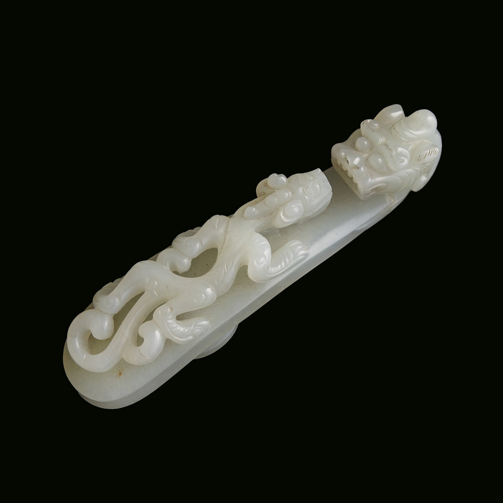 A Chinese white jade dragon hook, 18th century: A Chinese white jade dragon hook 18th century H: 4 3/8, W: 1, D: 1 1/8 in. (H: 11.1, W: 2.5, D: 2.9 cm.) From Mr. Shapiro in Edison, New Jersey. Click