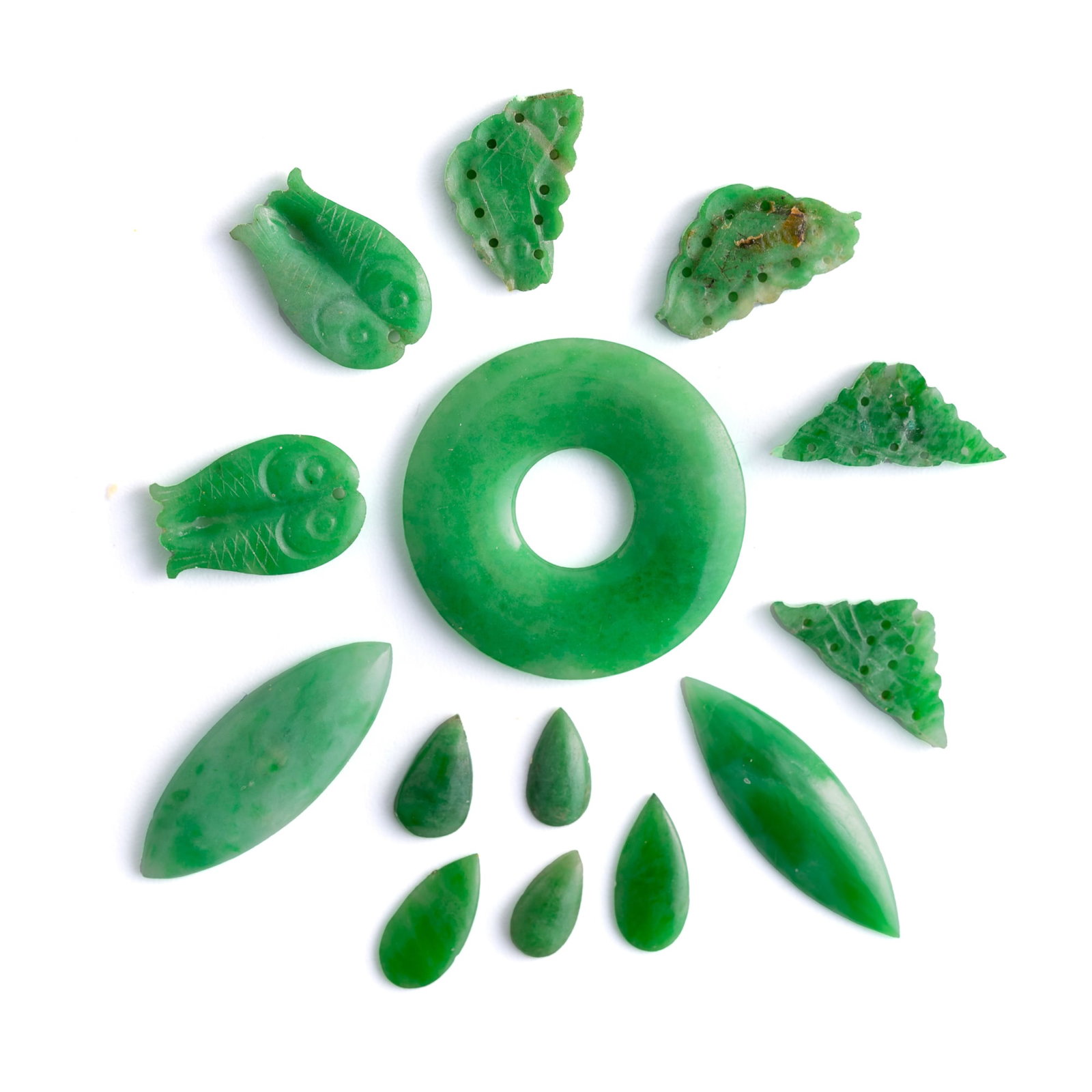 Fourteen Chinese jadeite ornaments, Qing dynasty: Fourteen Chinese jadeite ornaments Qing dynasty Dia: 20.4 mm (largest) From Mrs. Lin in Irvine, California. Click here for high resolution images.
