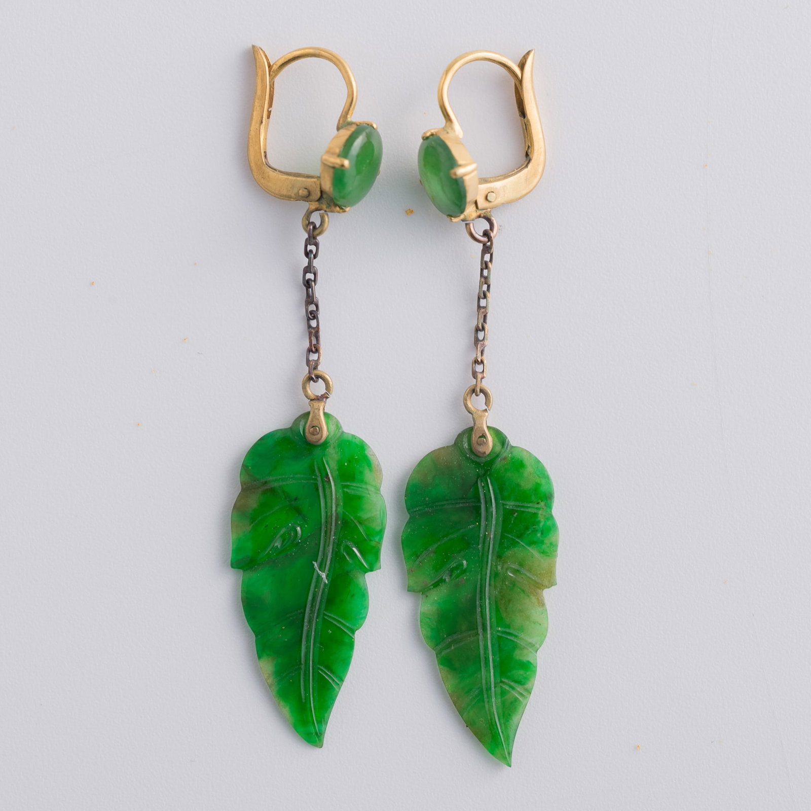 A pair of Chinese jadeite leaf-shaped earrings, Qing dynasty: A pair of Chinese jadeite leaf-shaped earrings Qing dynasty H: 2, W: 3/8 in. (H: 5.1, W: 1 cm. (each)) From Mrs. Lin in Irvine, California. Click here