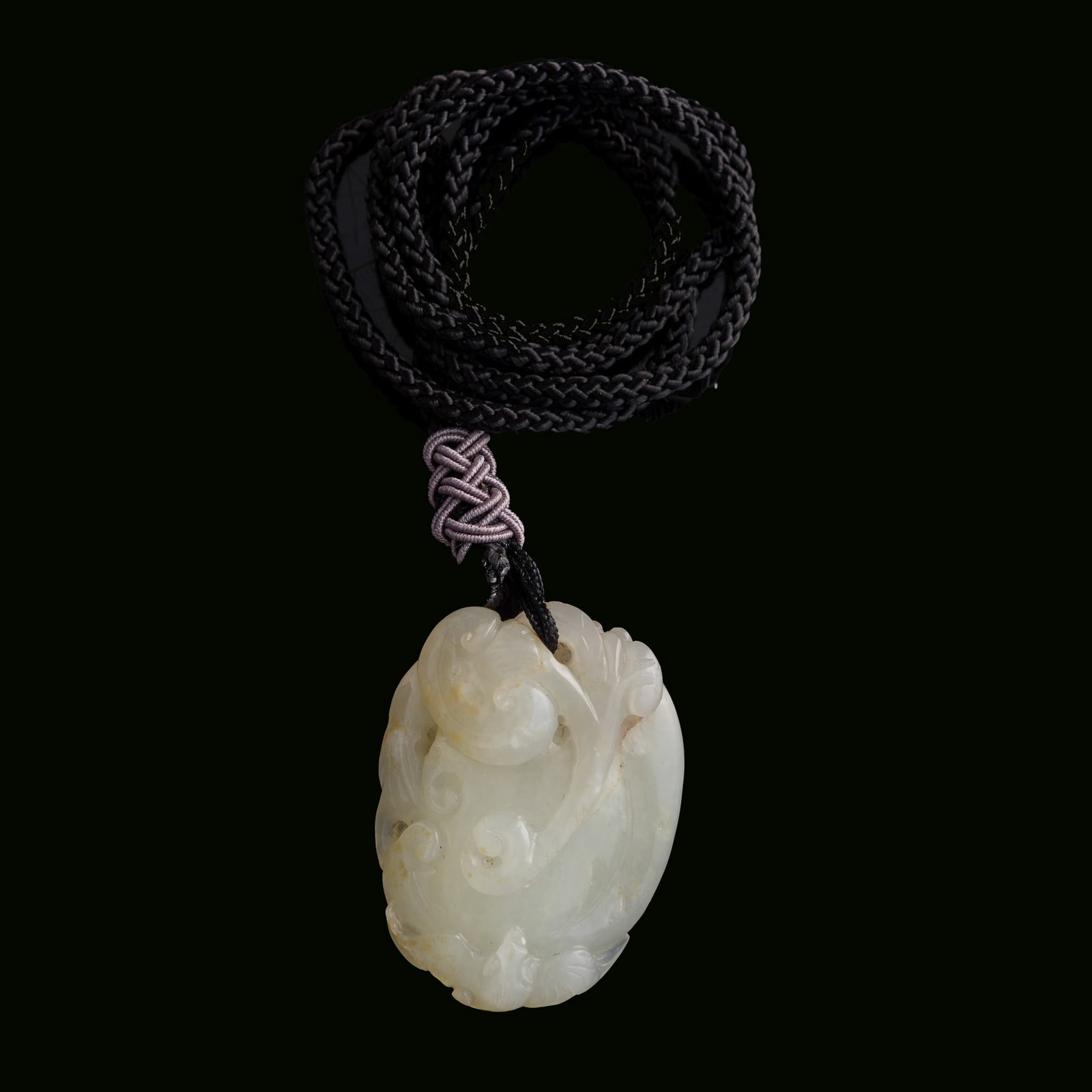 A Chinese carved white jade 'lingzhi' pendant, 18th century: A Chinese carved white jade 'lingzhi' pendant 18th century H: 2, W: 1 1/2, D: 3/4 in. (H: 5.1, W: 3.8, D: 1.9 cm.) Private collection, La Jolla, California.
