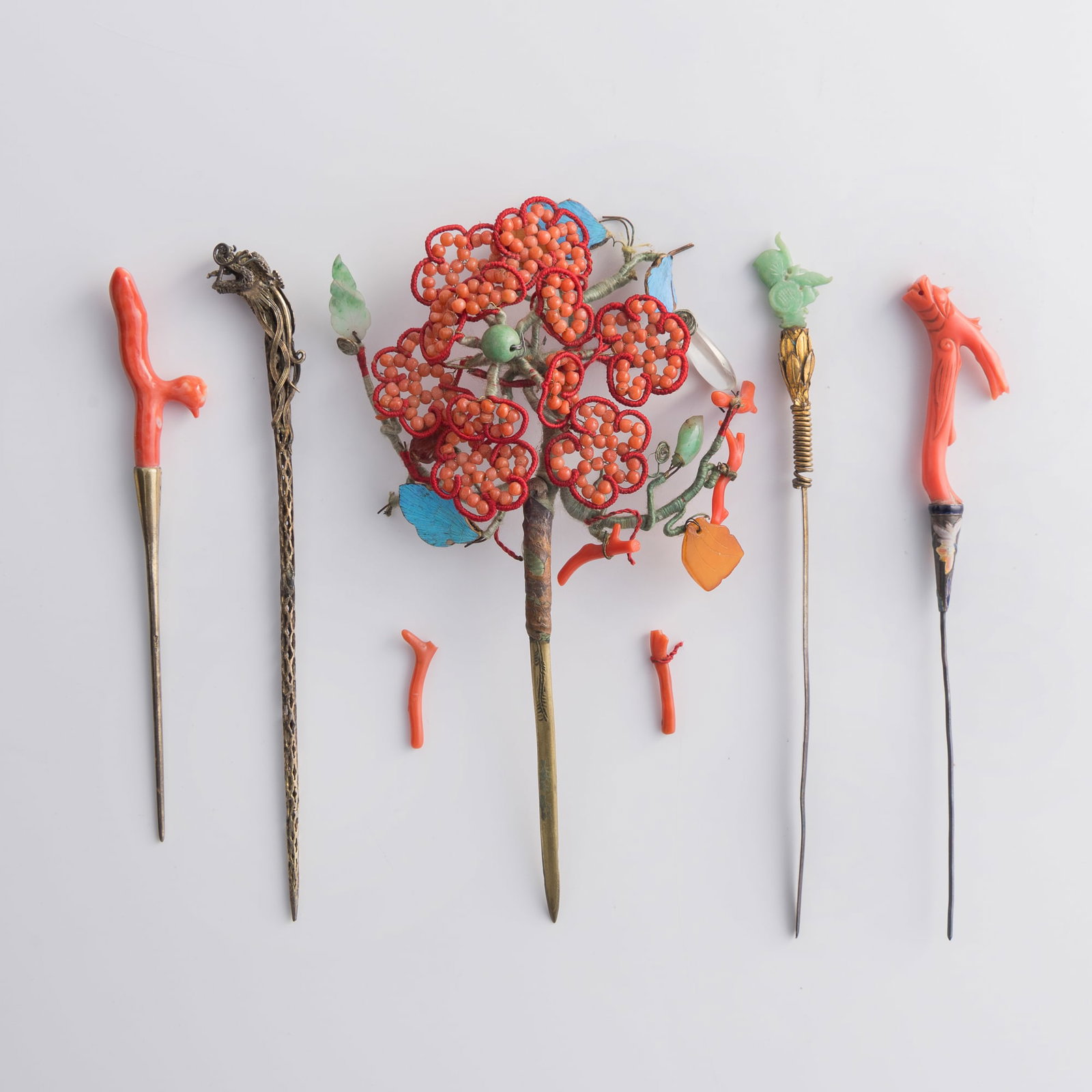 Five Chinese metal hairpins with assorted ornaments, Qing dynasty: Five Chinese metal hairpins with assorted ornaments Qing dynasty H: 6 3/8, W: 3 5/8, D: 1 1/4 in. (H: 16.2, W: 9.2, D: 3.2 cm. (largest)) Weight: 62.1 g (overall) From Mrs. Morrison, Silver Spring, Ma