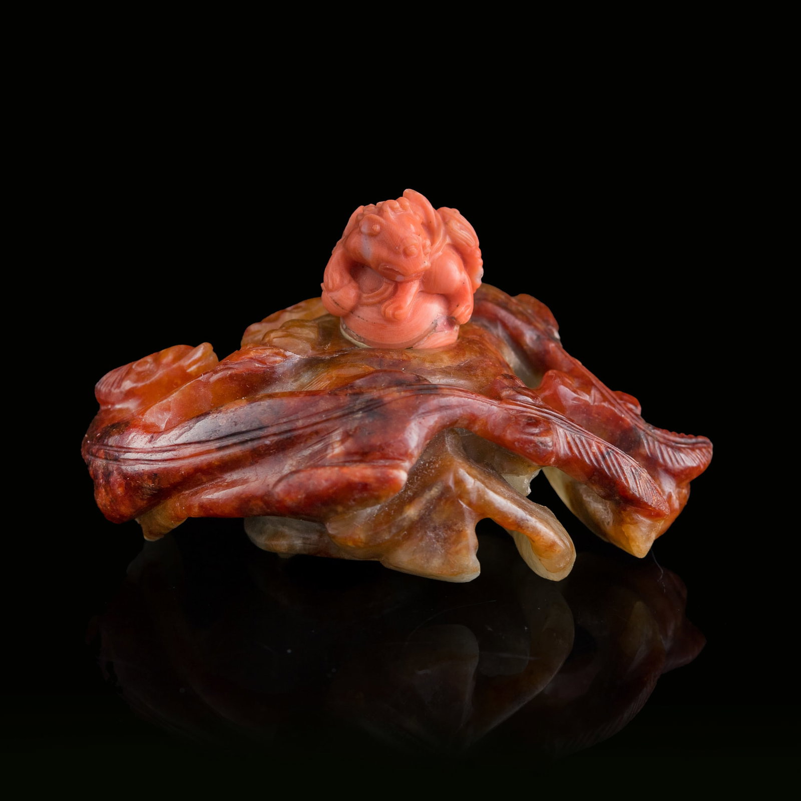 A Chinese carved red jadeite 'chilong' water coupe, Qing dynasty: A Chinese carved red jadeite 'chilong' water coupe Qing dynasty Sold with original coral cover. H: 2, W: 3 1/4, D: 2 3/8 in. (H: 5.1, W: 8.3, D: 6 cm.) From Mrs. Morrison, Silver Spring, Maryland.