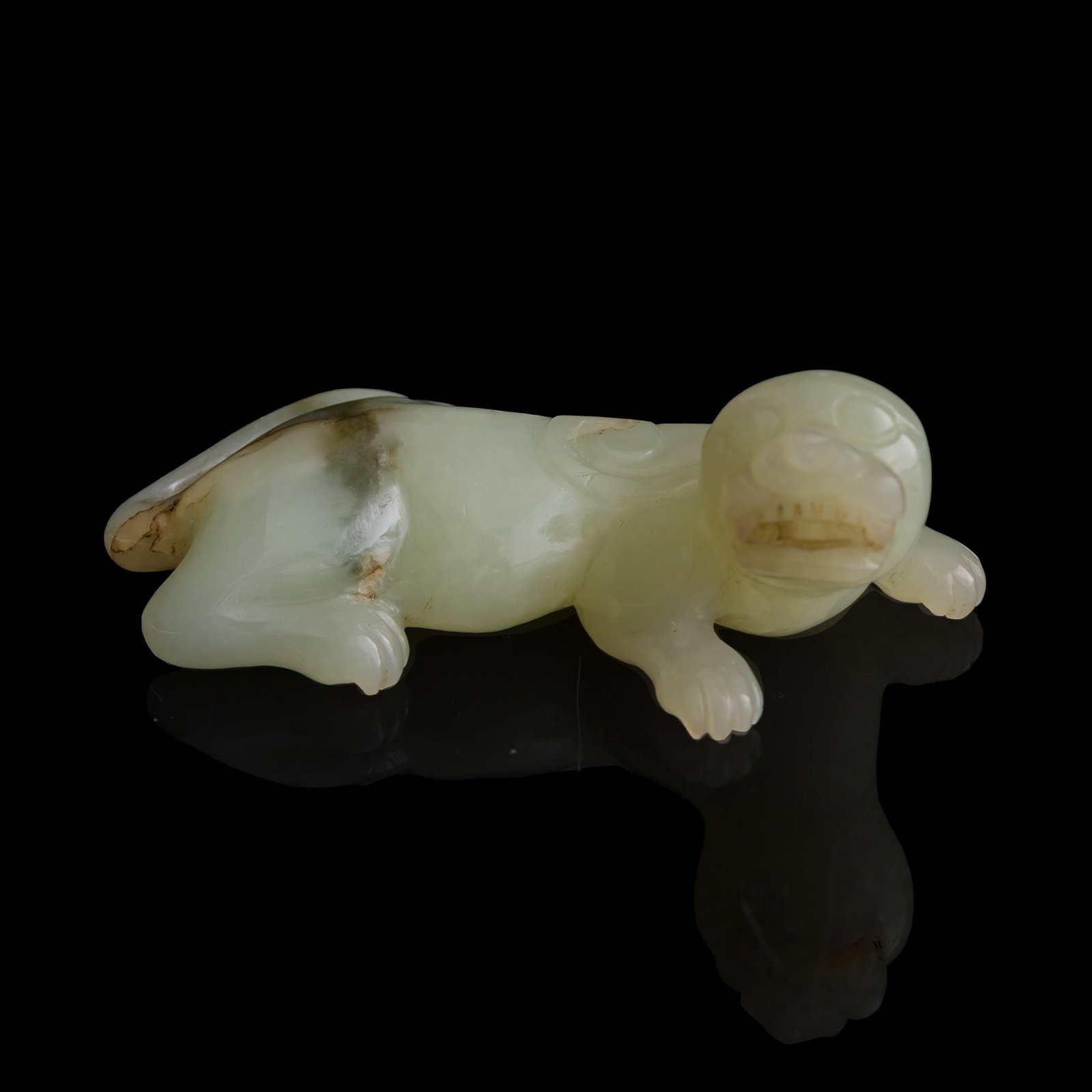 A Chinese jade carving of a mythical beast, Ming dynasty: A Chinese jade carving of a mythical beast Ming dynasty H: 1 1/4, W: 3 3/8, D: 1 7/8 in. (H: 3.2, W: 8.6, D: 4.8 cm.) From Mrs. Chang, Huntington Beach, California; acquired by her late husband.