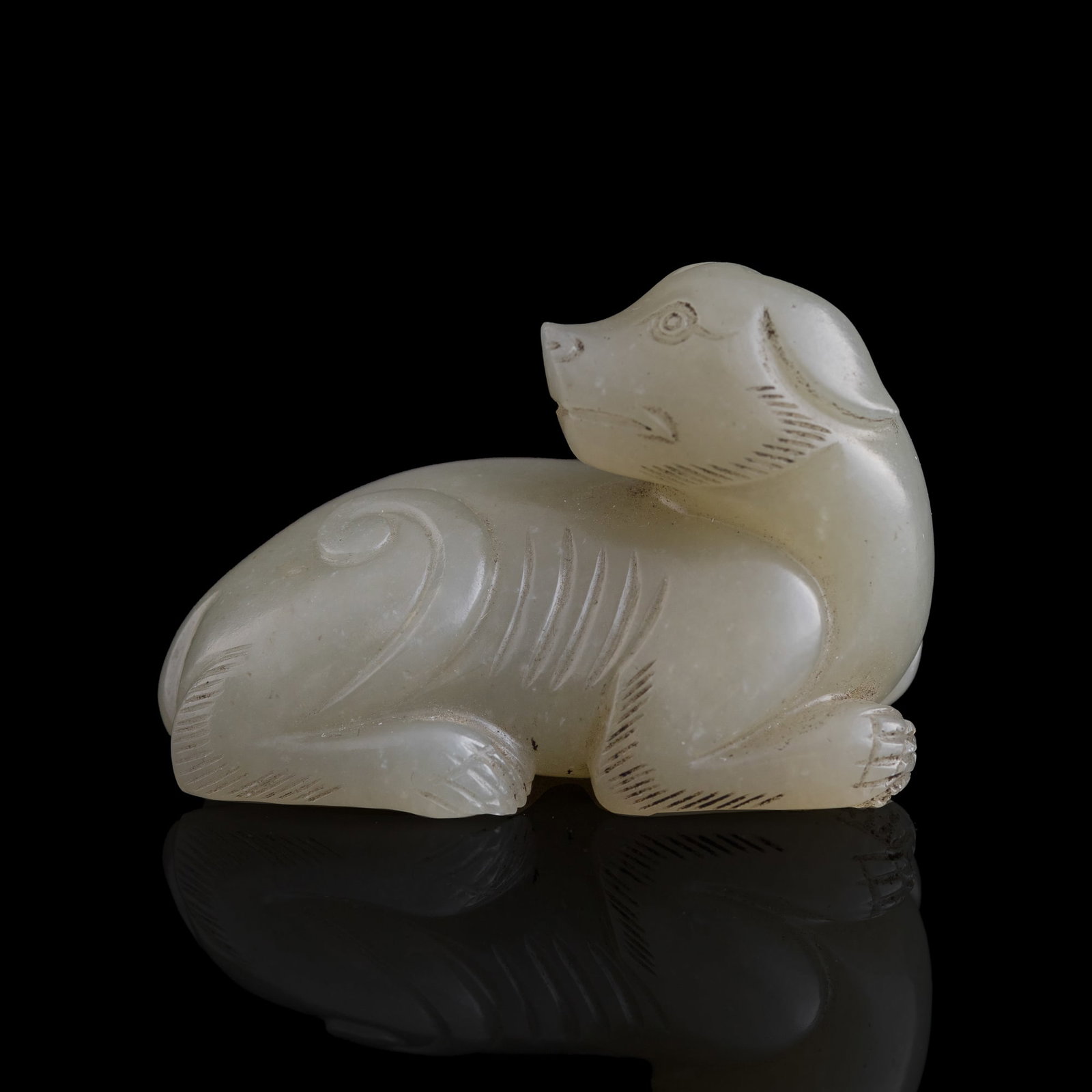 A Chinese white jade beast-form pendant, 18th/19th century: A Chinese white jade beast-form pendant 18th/19th century H: 1 1/4, W: 2, D: 1 in. (H: 3.2, W: 5.1, D: 2.5 cm.) Private collection, Southern California.
