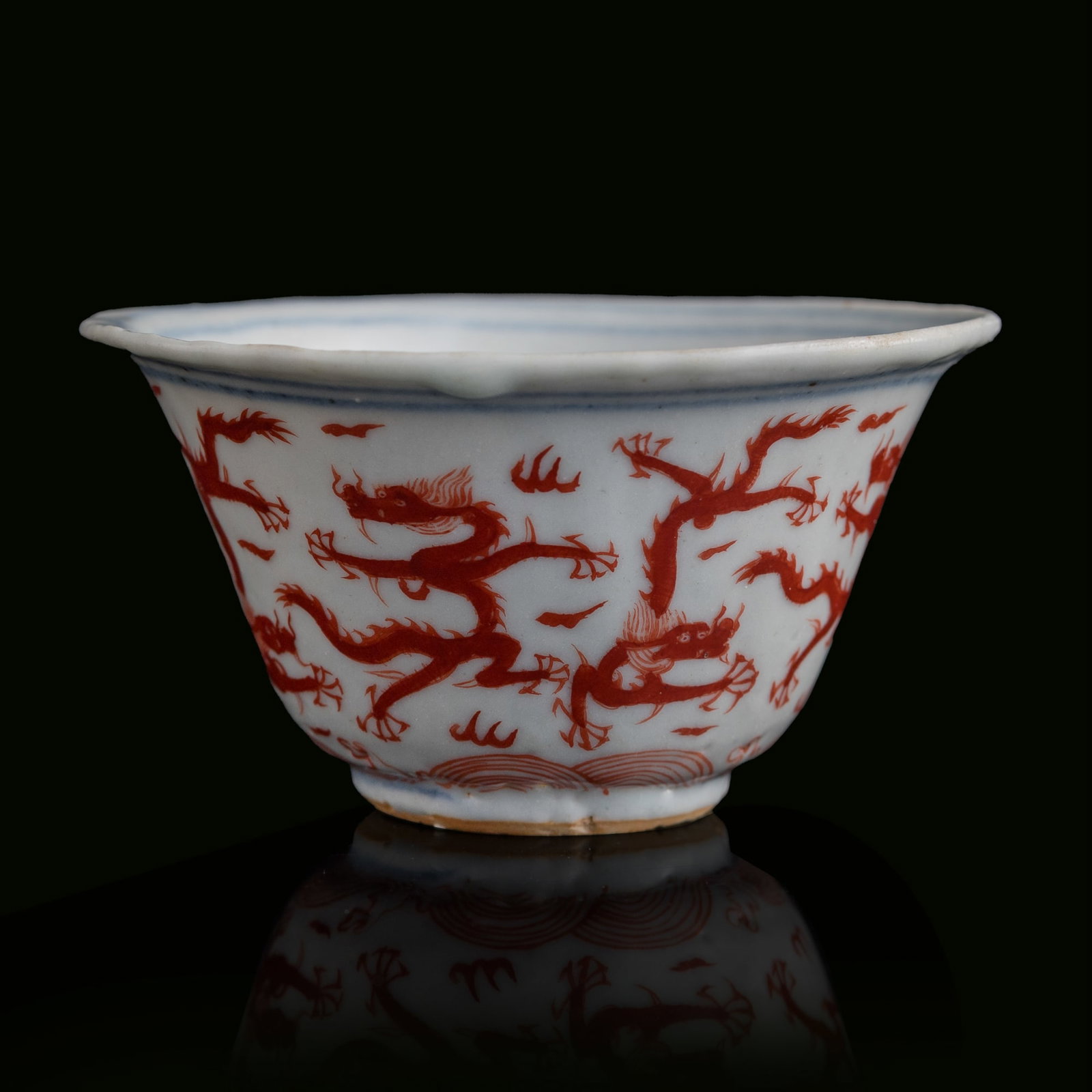 A Chinese iron red 'dragon' cup, Jiajing period, Ming dynasty: A Chinese iron red 'dragon' cup Jiajing period, Ming dynasty H: 1 7/8, Dia: 3 1/2 in. (H: 4.8, Dia: 8.9 cm.) From Ms. Chow in Flushing, New York. Click
