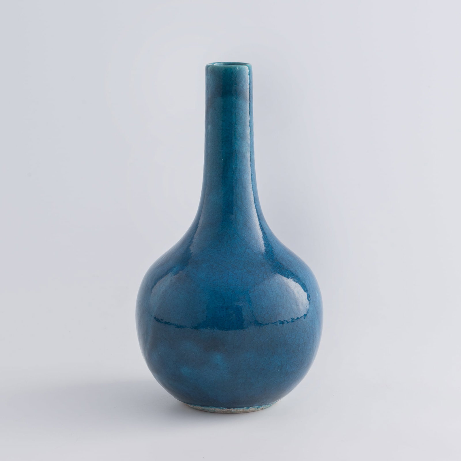 A Chinese peacock blue-glazed tianqiu vase, 19th century: A Chinese peacock blue-glazed tianqiu vase 19th century H: 8 1/2, Dia: 4 1/2 in. (H: 21.6, Dia: 11.4 cm.) From Mr. Kaufman in Arlington, Virginia; a family heirloom.