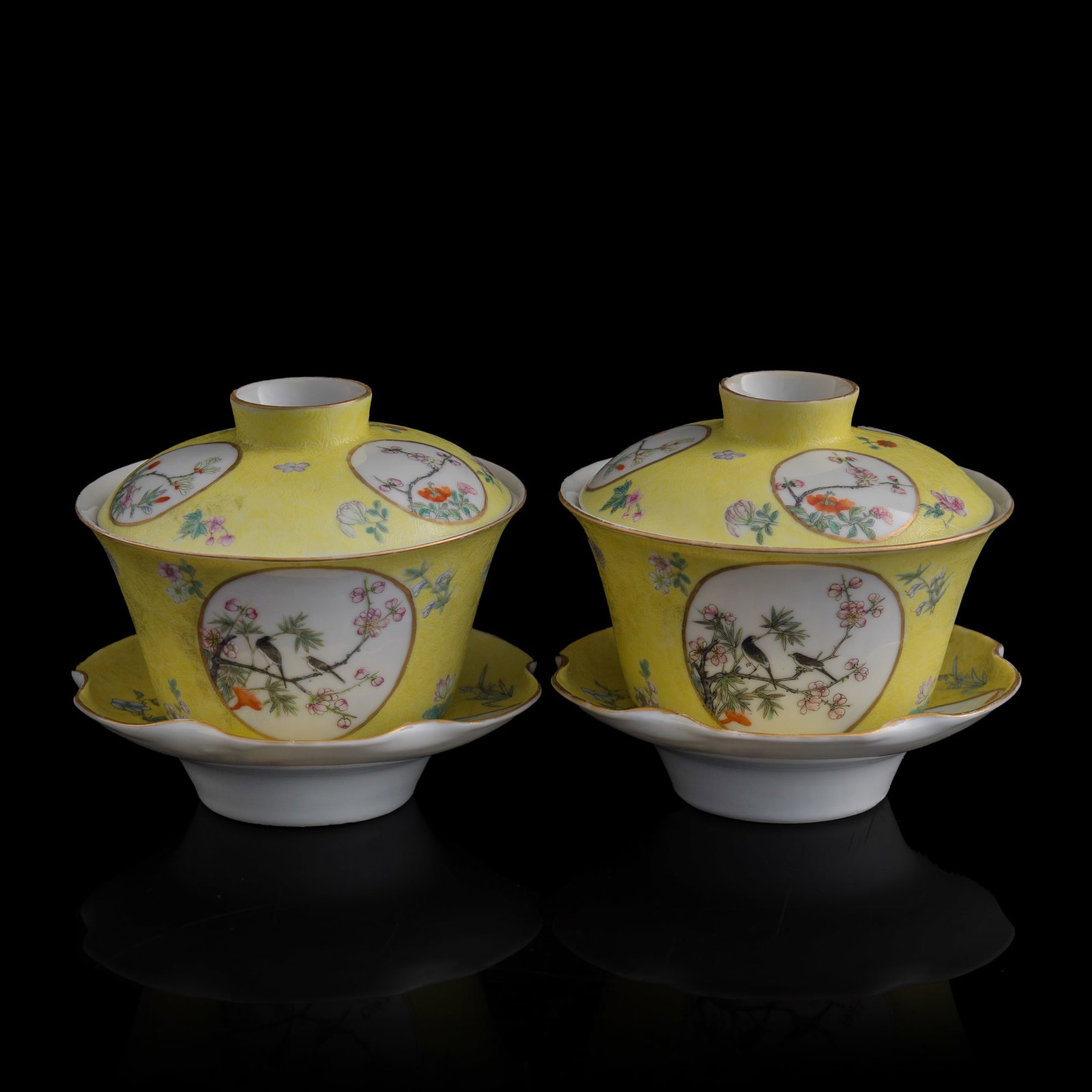 A pair of Chinese yellow-ground famille rose covered bowls, Republic period: A pair of Chinese yellow-ground famille rose covered bowls Republic period Each lid and bowl underside with "Juren tang zhi" mark. (2). H: 4, Dia: 4 1/4 in. (H: 10.2, Dia: 10.8 cm. (each)) From Mr. Ch