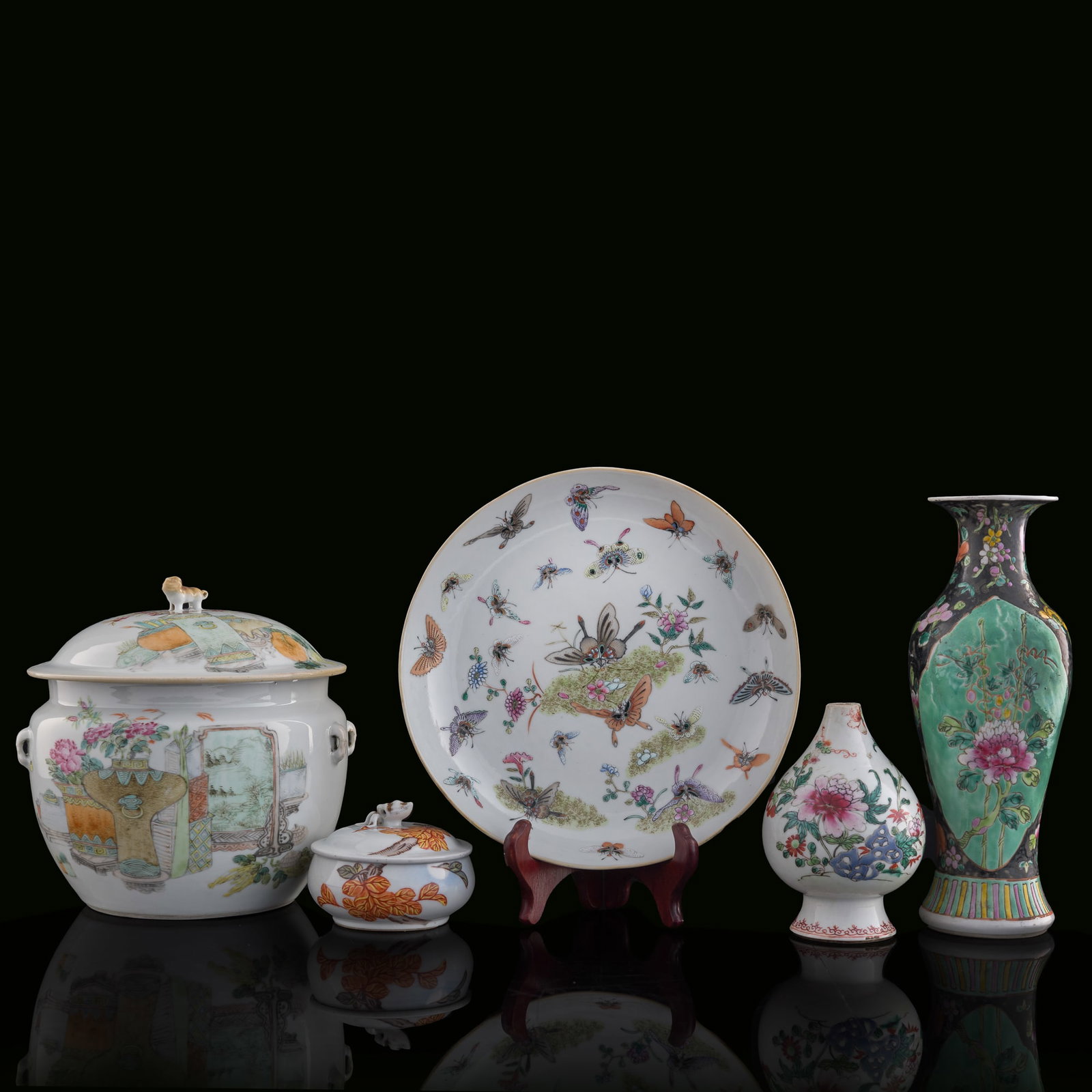 Five assorted Chinese famille rose items, Qing dynasty: Five assorted Chinese famille rose items Qing dynasty Comprising a black-ground vase with four-character mark to underside; a 'bogu' covered jar with four-character mark to underside; a 'hundred butte
