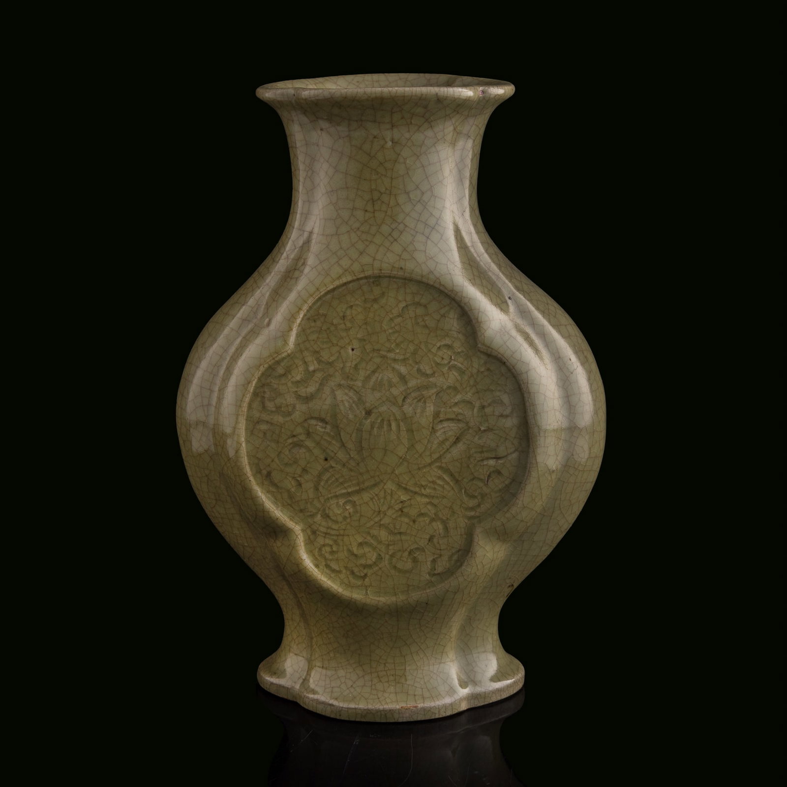 A Chinese Longquan-type celadon lobed vase, Qing dynasty: A Chinese Longquan-type celadon lobed vase Qing dynasty H: 10 7/8, W: 7 3/4, D: 3 3/4 in. (H: 27.6, W: 19.7, D: 9.5 cm.) Private collection, Pennsylvania.