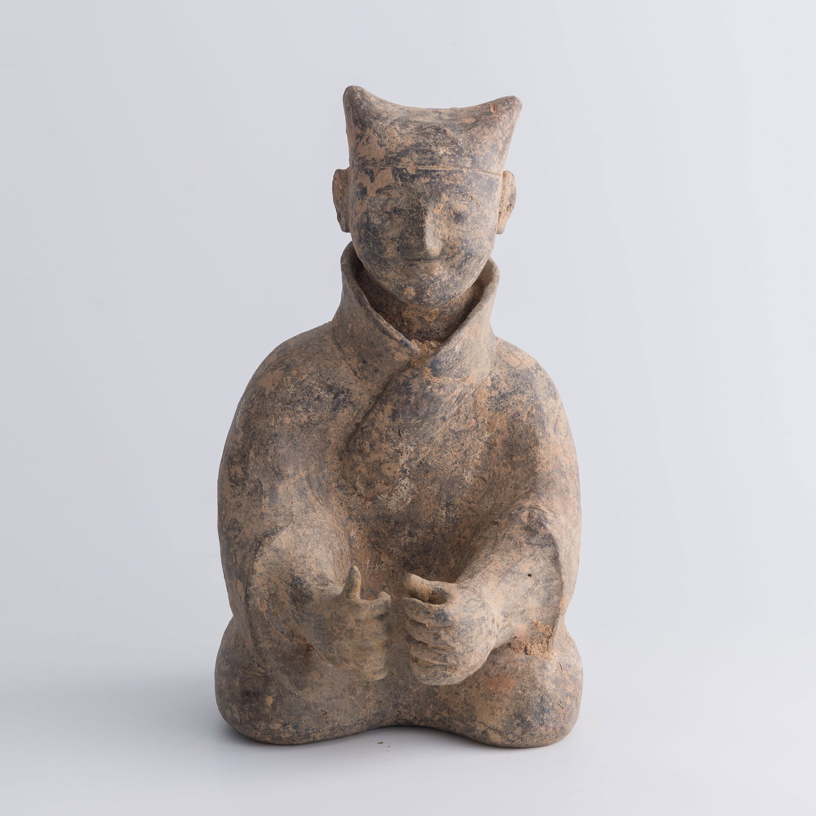 A Chinese pottery seated figure, Han dynasty (1 of 11)