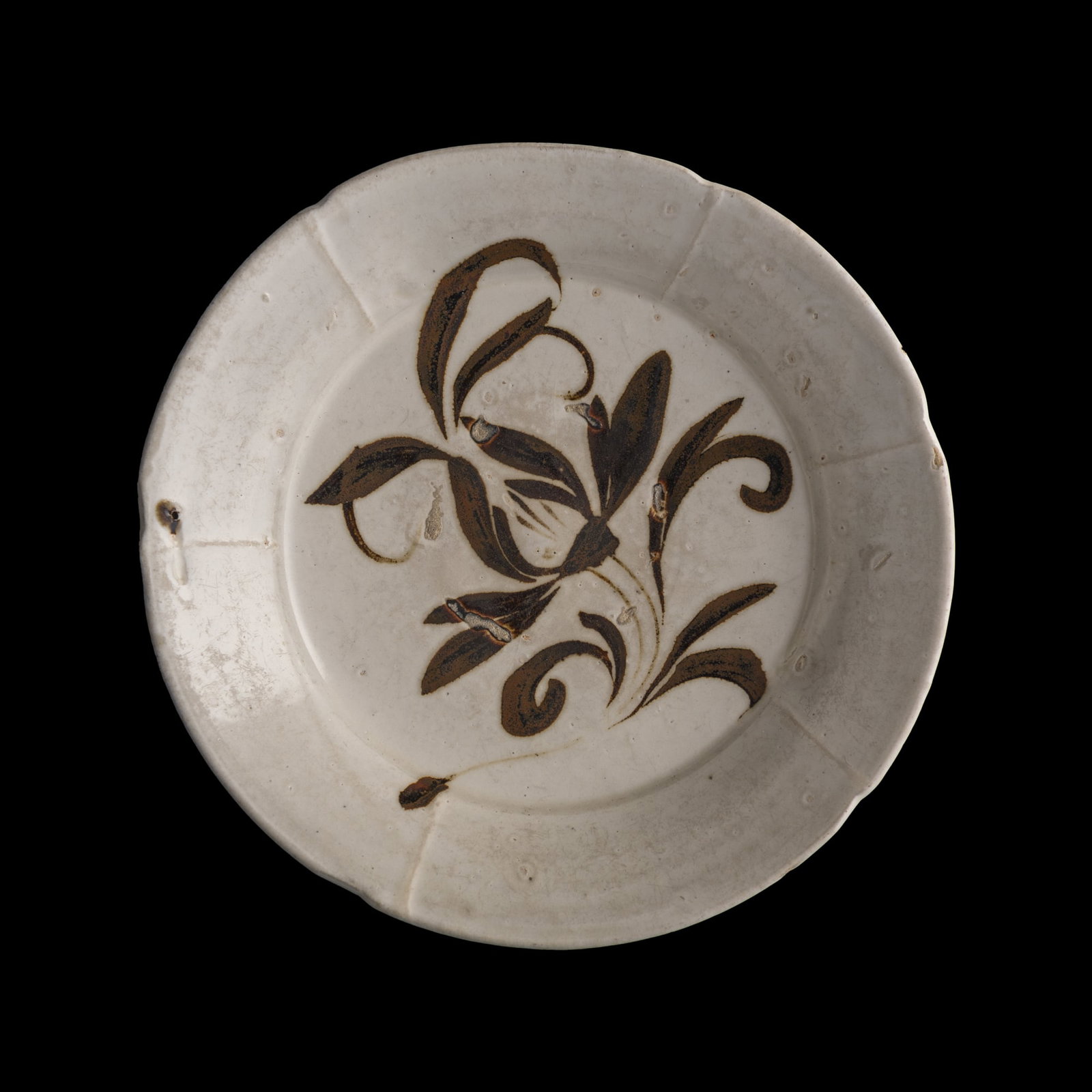A Chinese Cizhou ware white-ground black-painted foliate dish, Song dynasty: A Chinese Cizhou ware white-ground black-painted foliate dish Song dynasty H: 1 1/2, Dia: 7 5/8 in. (H: 3.8, Dia: 19.4 cm.) Private collection, New Jersey.