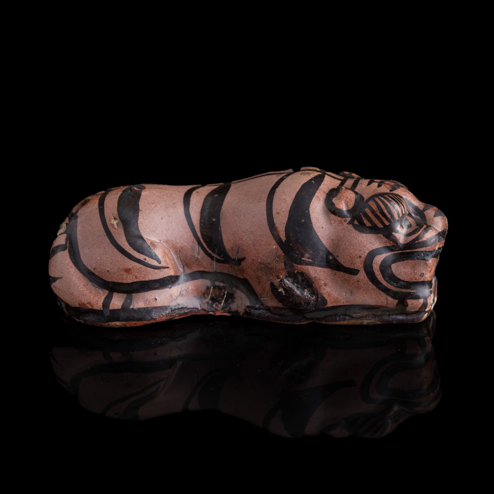 A Chinese Cizhou ware tiger-form water dropper, Jin dynasty: A Chinese Cizhou ware tiger-form water dropper Jin dynasty H: 1 1/2, W: 4 3/8, D: 2 1/8 in. (H: 3.8, W: 11.1, D: 5.4 cm.) Private collection, New Jersey.