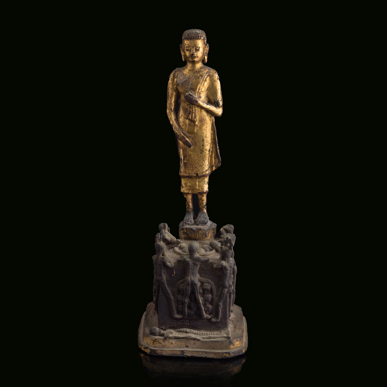 A Southeast Asian gilt-lacquered bronze standing figure of Shakyamuni, 18th/19th century: A Southeast Asian gilt-lacquered bronze standing figure of Shakyamuni 18th/19th century H: 11 1/4, W: 4, D: 4 5/8 in. (H: 28.6, W: 10.2, D: 11.7 cm.) Weight: 2162 g Private estate, Laguna Woods, Calif