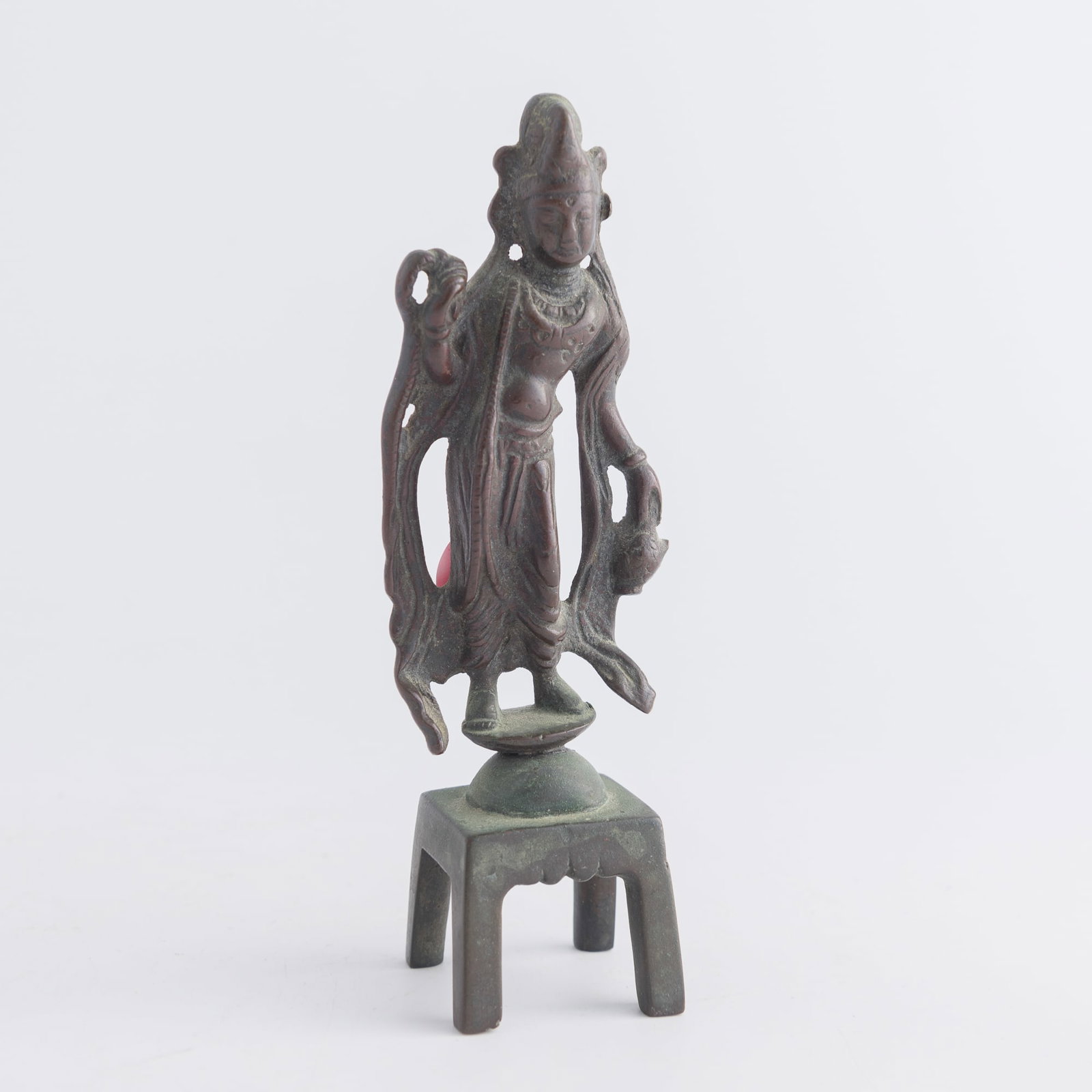 A Chinese bronze standing figure of Guanyin, Tang dynasty: A Chinese bronze standing figure of Guanyin Tang dynasty H: 5 1/4, W: 1 3/4, D: 1 1/4 in. (H: 13.3, W: 4.4, D: 3.2 cm.) Weight: 218.3 g Private estate, Carlsbad, California.